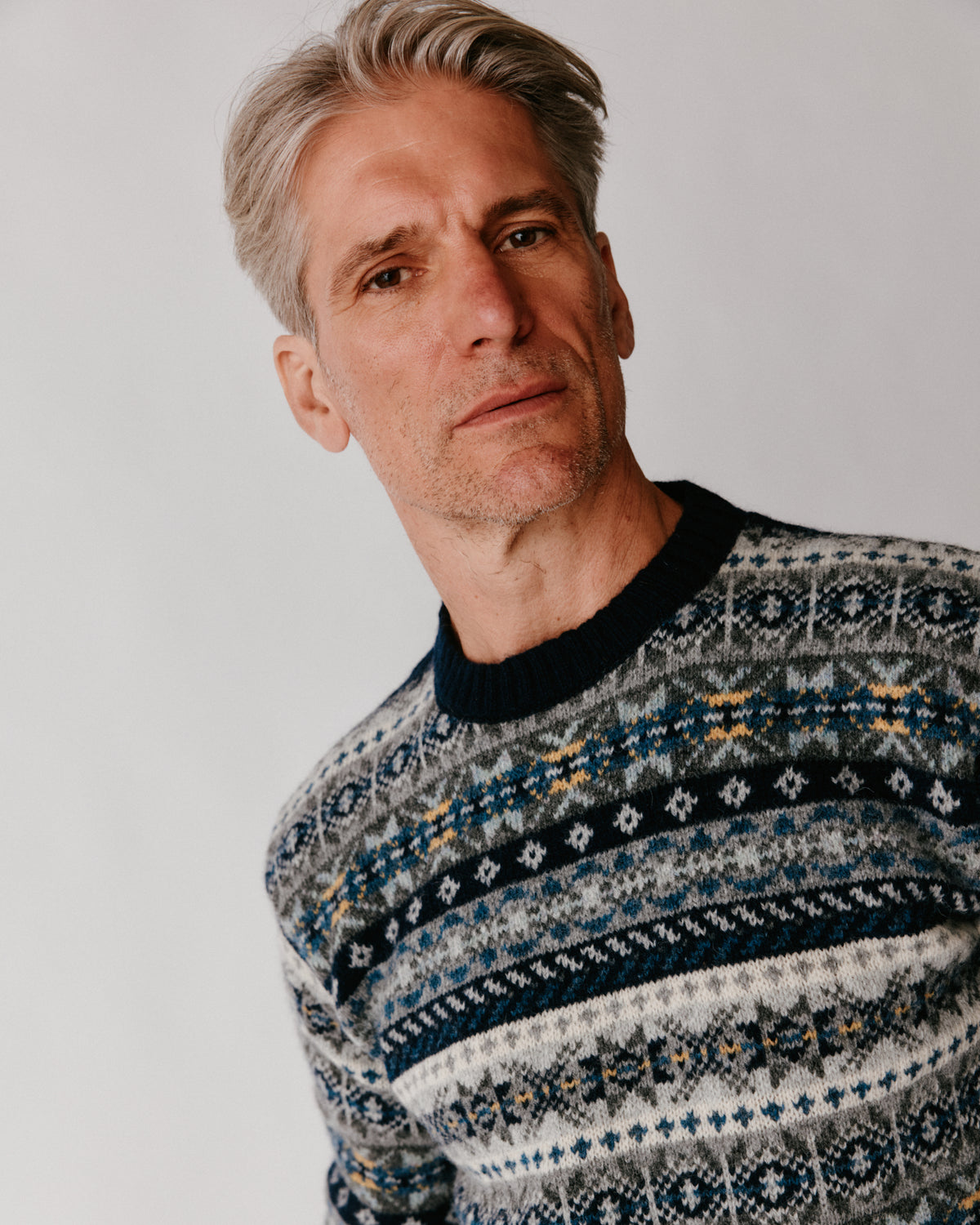 Model wearing the Bosie Blue Mogganer Crovie Fairisle in Navy – pure wool, knitted in Scotland by Harley of Scotland for Bosie Knitwear