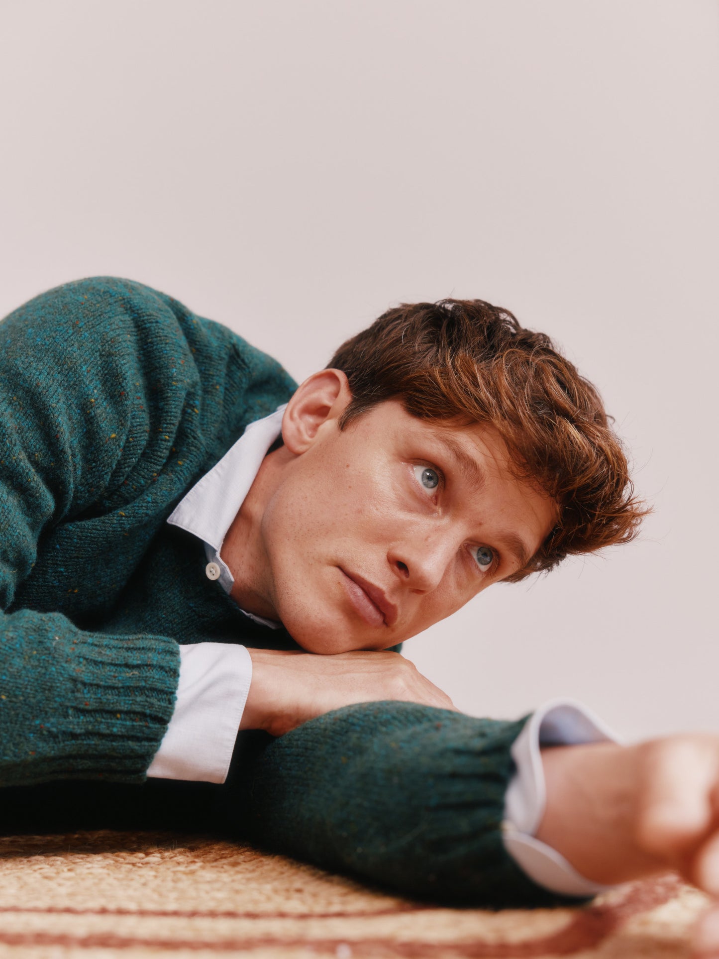 Model wearing a Bosie Knitwear Blue Mogganer Helmsman Glenugie Nep Sweater in colour Canna Green.