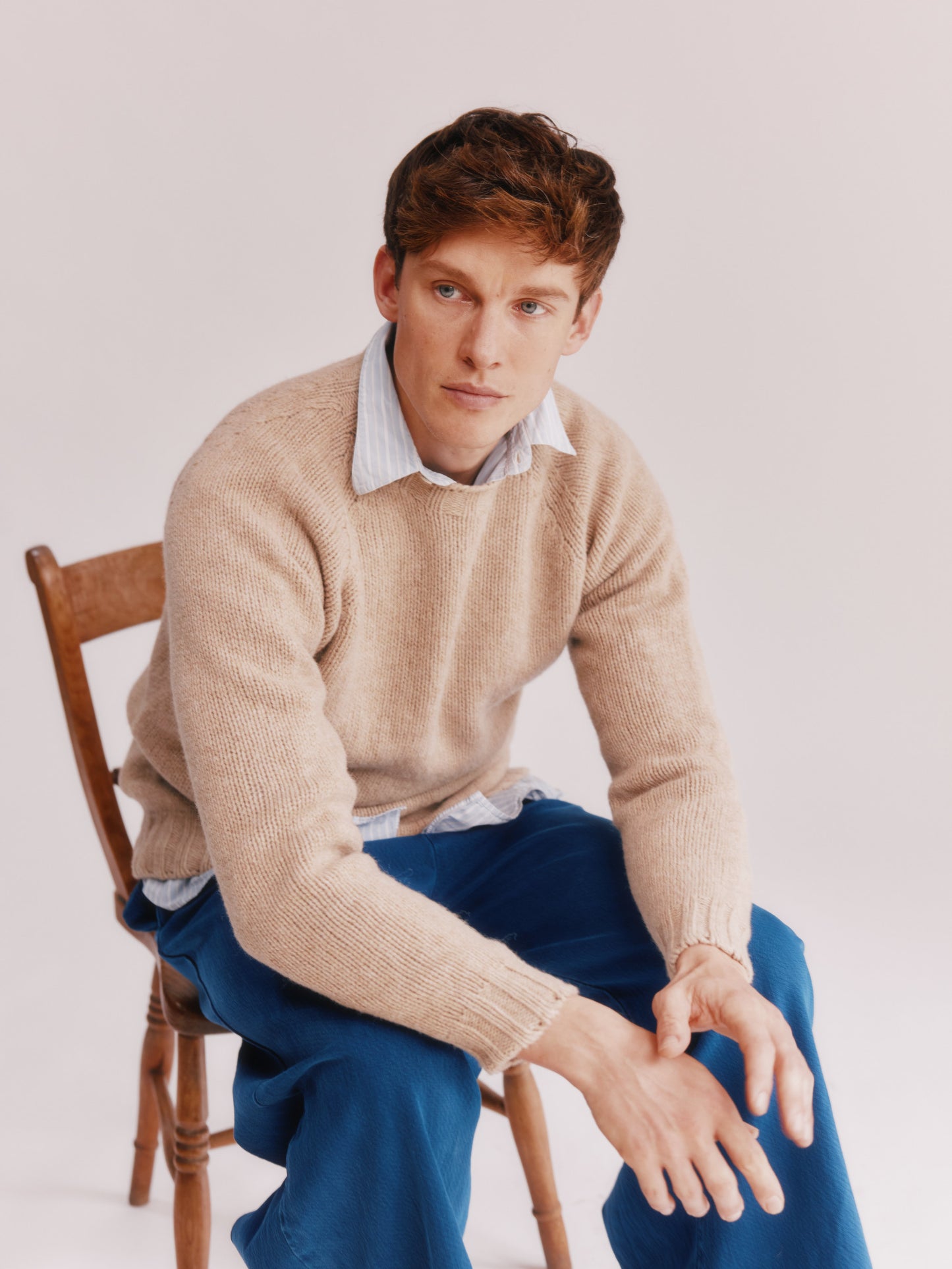 Model wearing a Bosie Knitwear Blue Mogganer North Sea Chunky Seamless Supersoft Shetland Sweater in colour Oatmilk Beige.