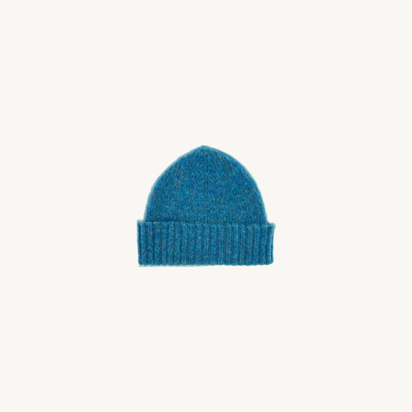 Flatbed photograph of Bosie Brushed Shetland Wool Beanie Hat in colour Azure Blue.