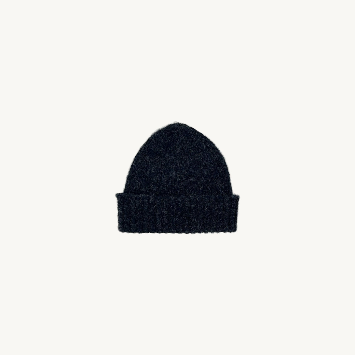 Flat bed photograph of Bosie Brushed Shetland Wool Beanie Hat in the colour Charcoal Black.
