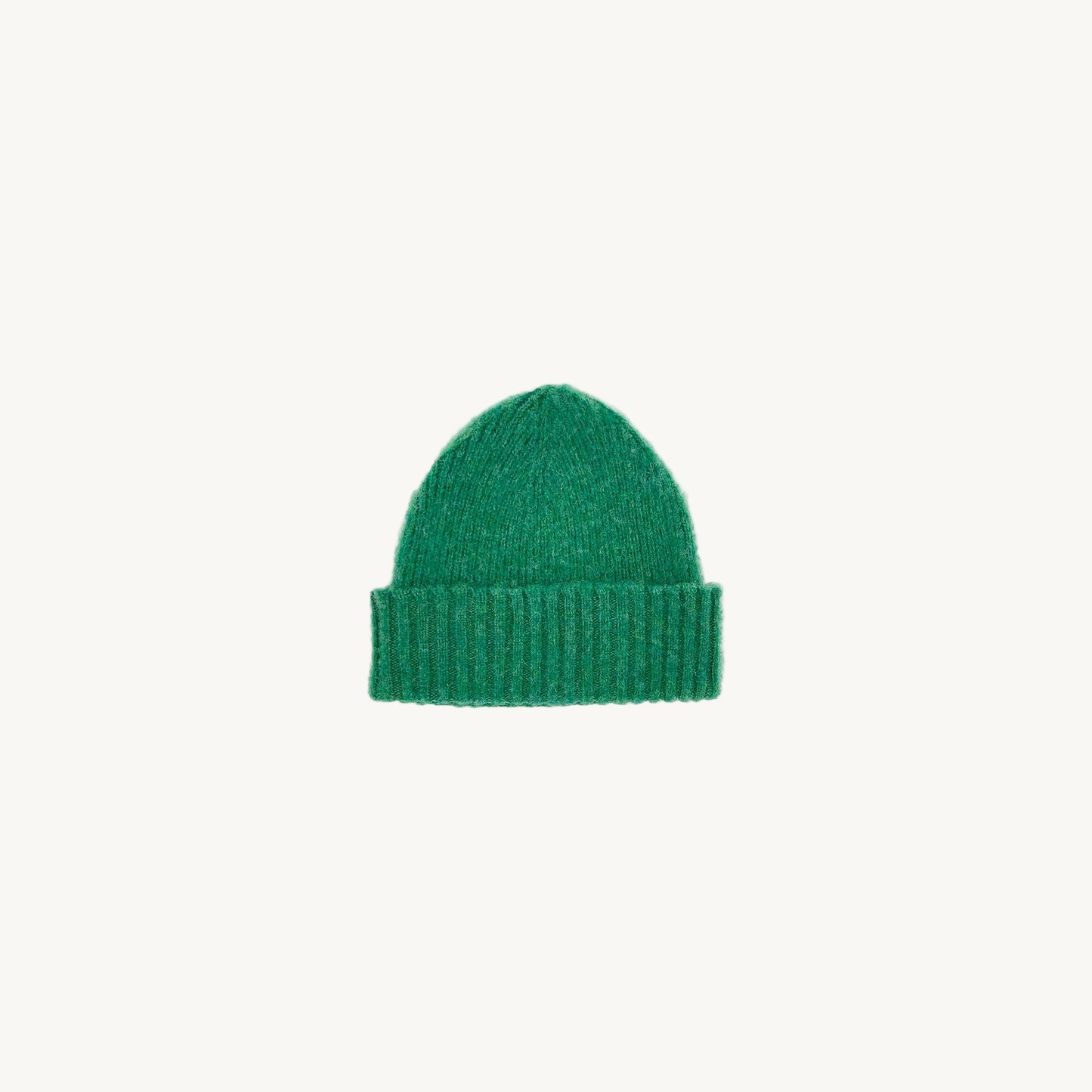 Flat bed photograph of Bosie Brushed Shetland Wool Beanie Hat in the colour Kelly Green.