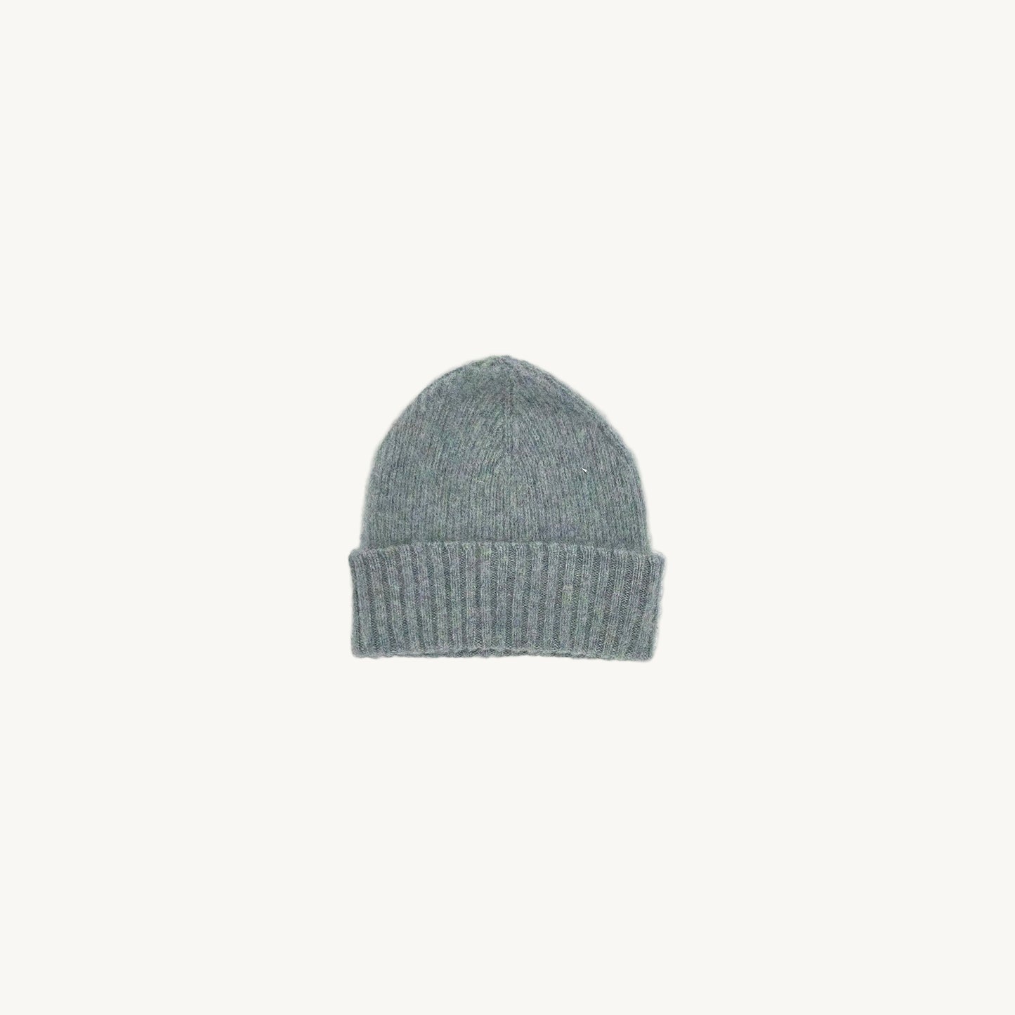 Flat bed photograph of Bosie Brushed Shetland Wool Beanie Hat in the colour Sea Pearl.