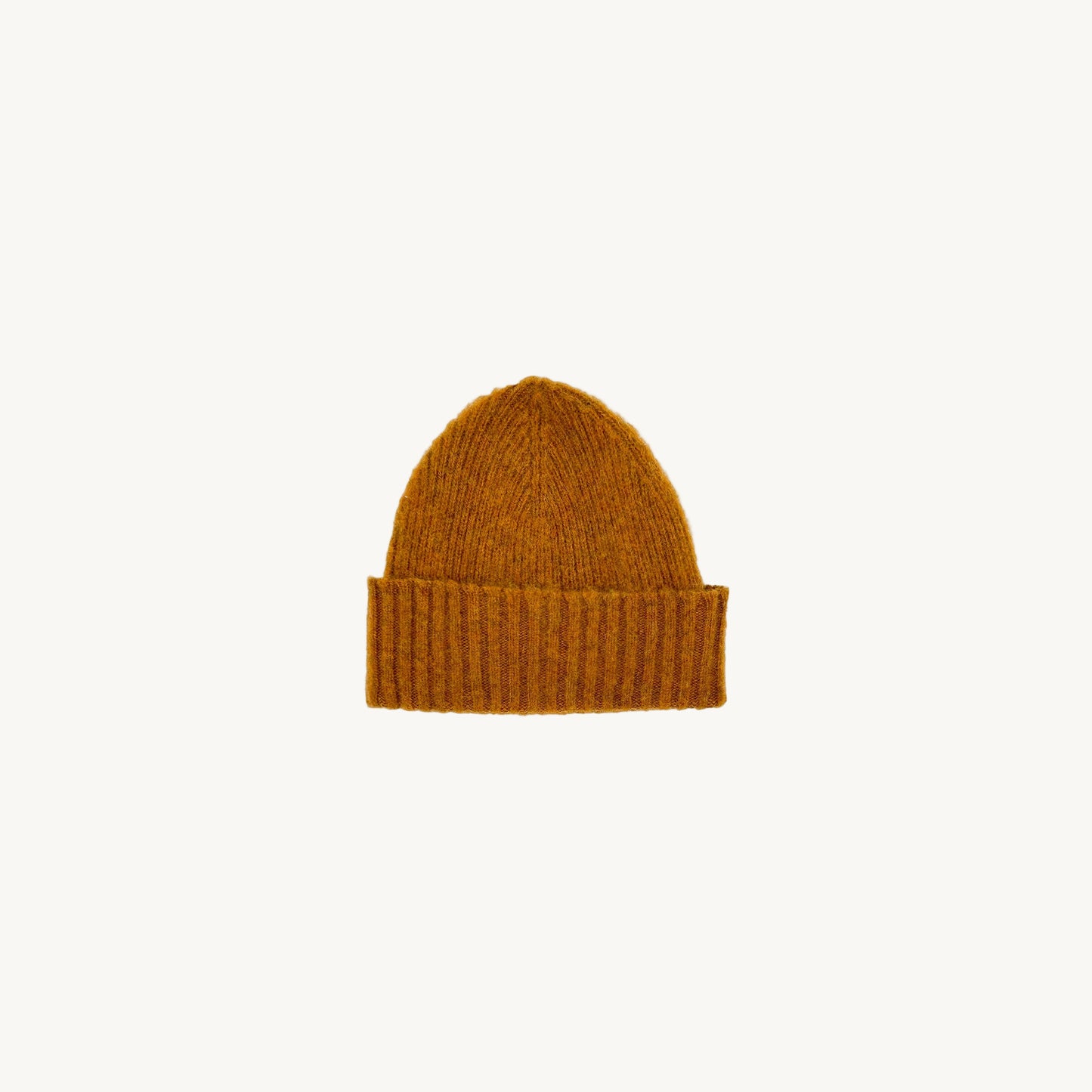 Flat bed photograph of Bosie Brushed Shetland Wool Beanie Hat in the colour Vintage Orange.