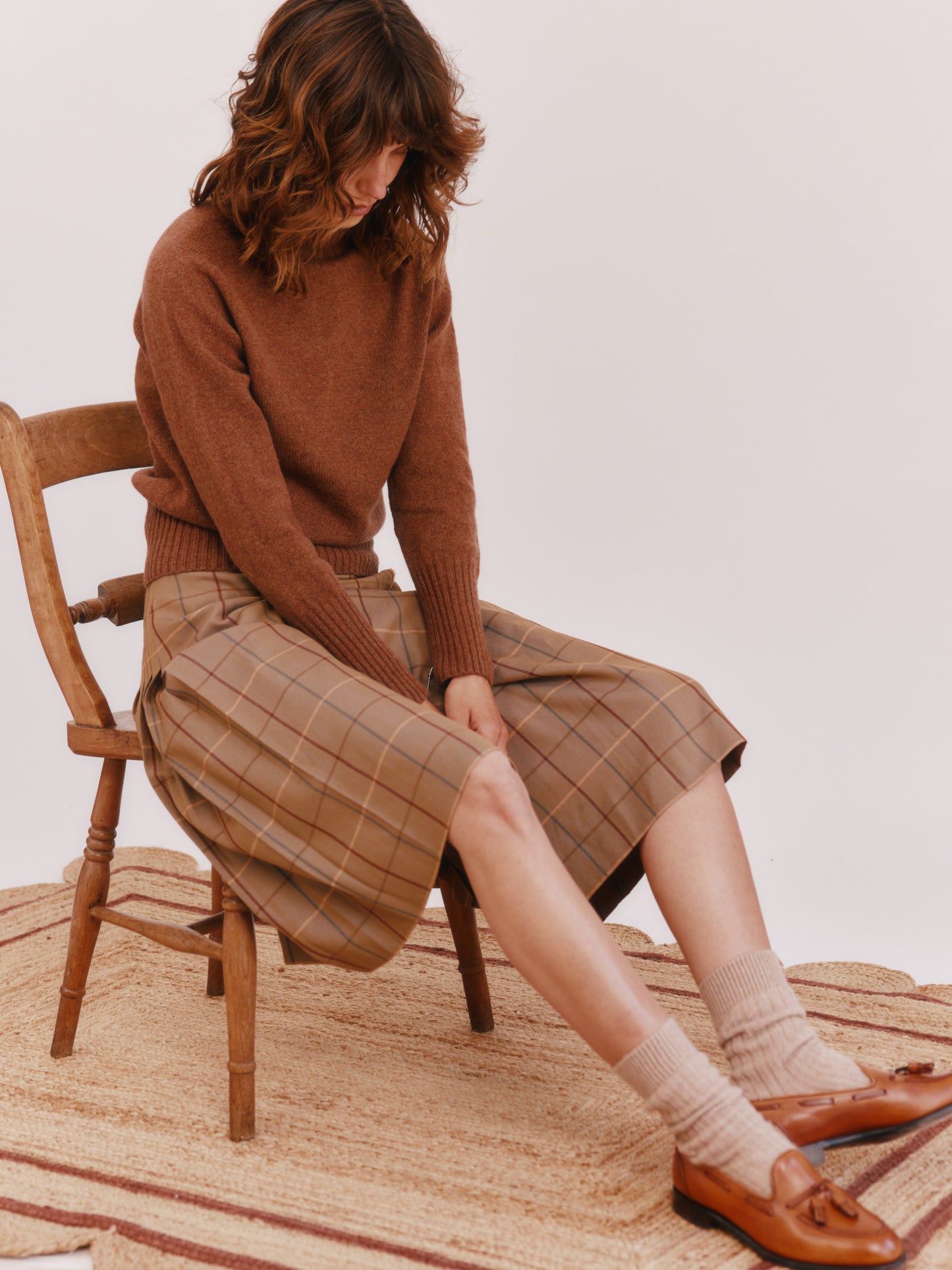 Model wearing a Bosie Knitwear Geelong Polo Neck Womens Jumper in colour Hazelnut Brown.