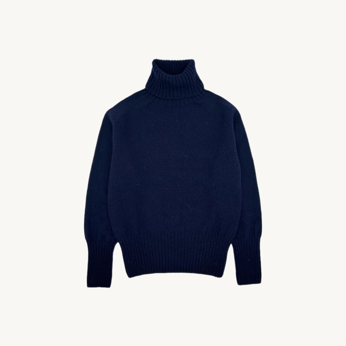 Flatbed photograph of a Bosie Geelong Polo Neck Womens Jumper in colour Navy.