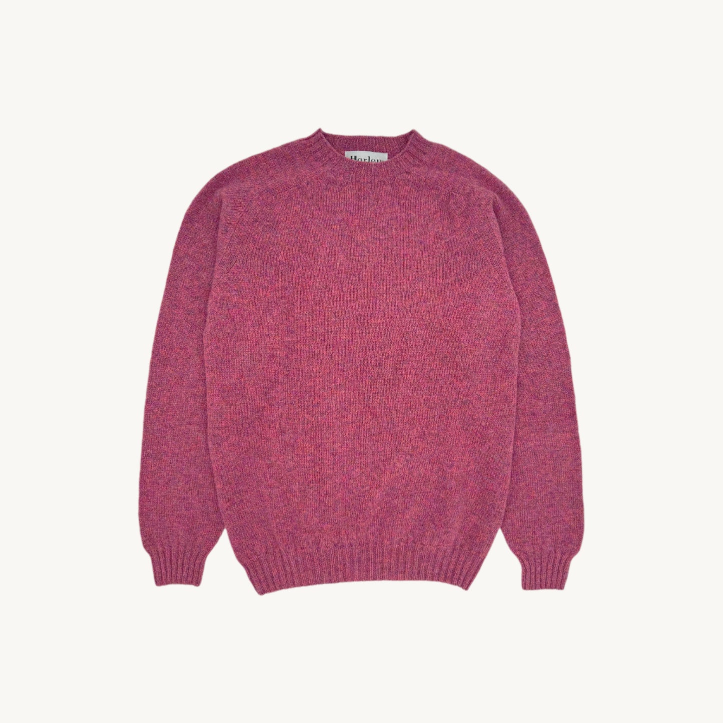 Flatbed photograph of harley of scotland mens seamless saddle shoulder shetland sweater in colour zinnia magenta.