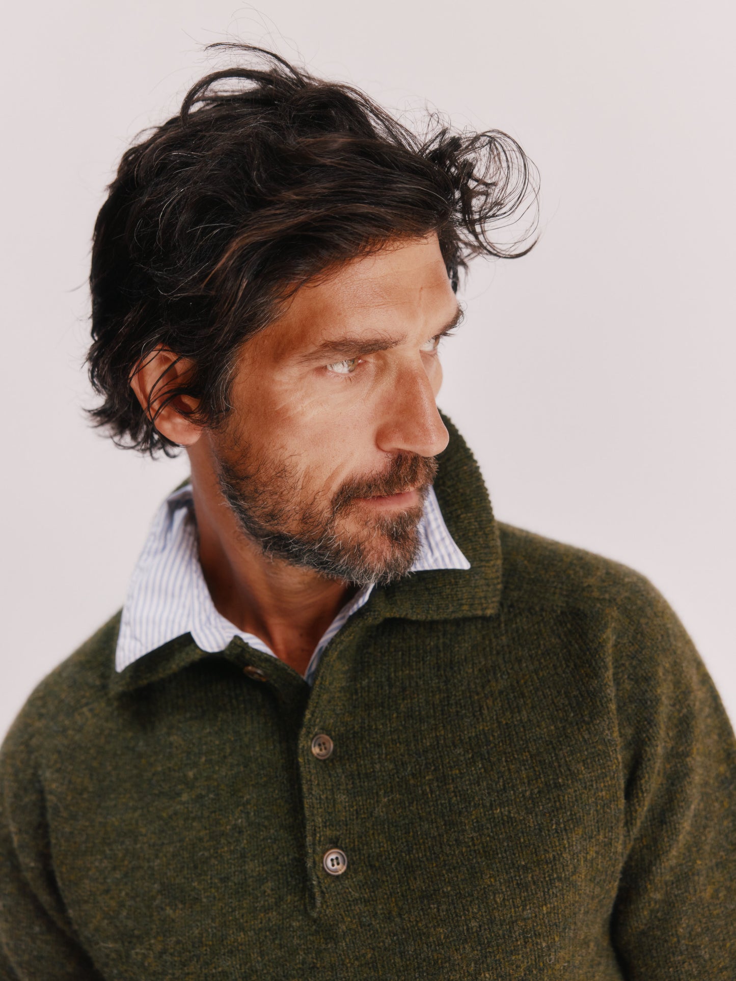 Model wearing a Bosie Knitwear Harley of Scotland Mens Shetland Eton Collar Sweater in colour Pineshadow Green.