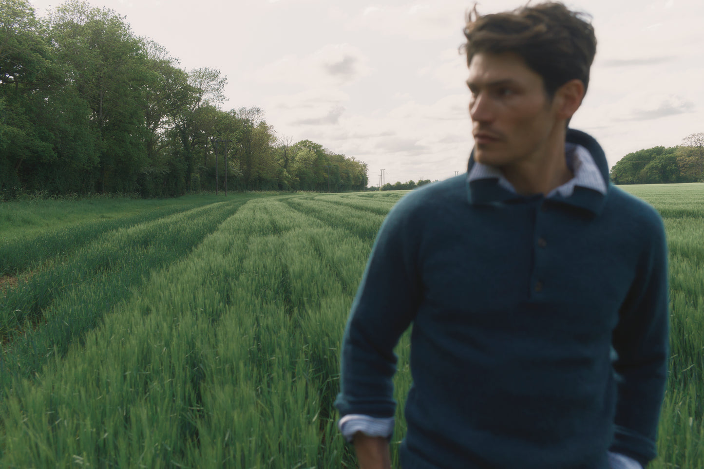 Model wearing a Bosie Knitwear Harley of Scotland Mens Shetland Eton Collar Sweater in colour Storm Dark Teal.