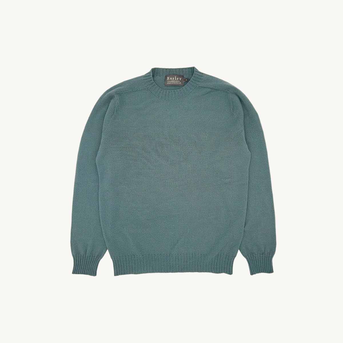 Flatbed photograph of the Bosie Harley of Scotland x Todd and Duncan Pure Men's Cashmere Sweater in Marine Blue – seamless, seam-free pure cashmere, knitted in Scotland by Harley of Scotland