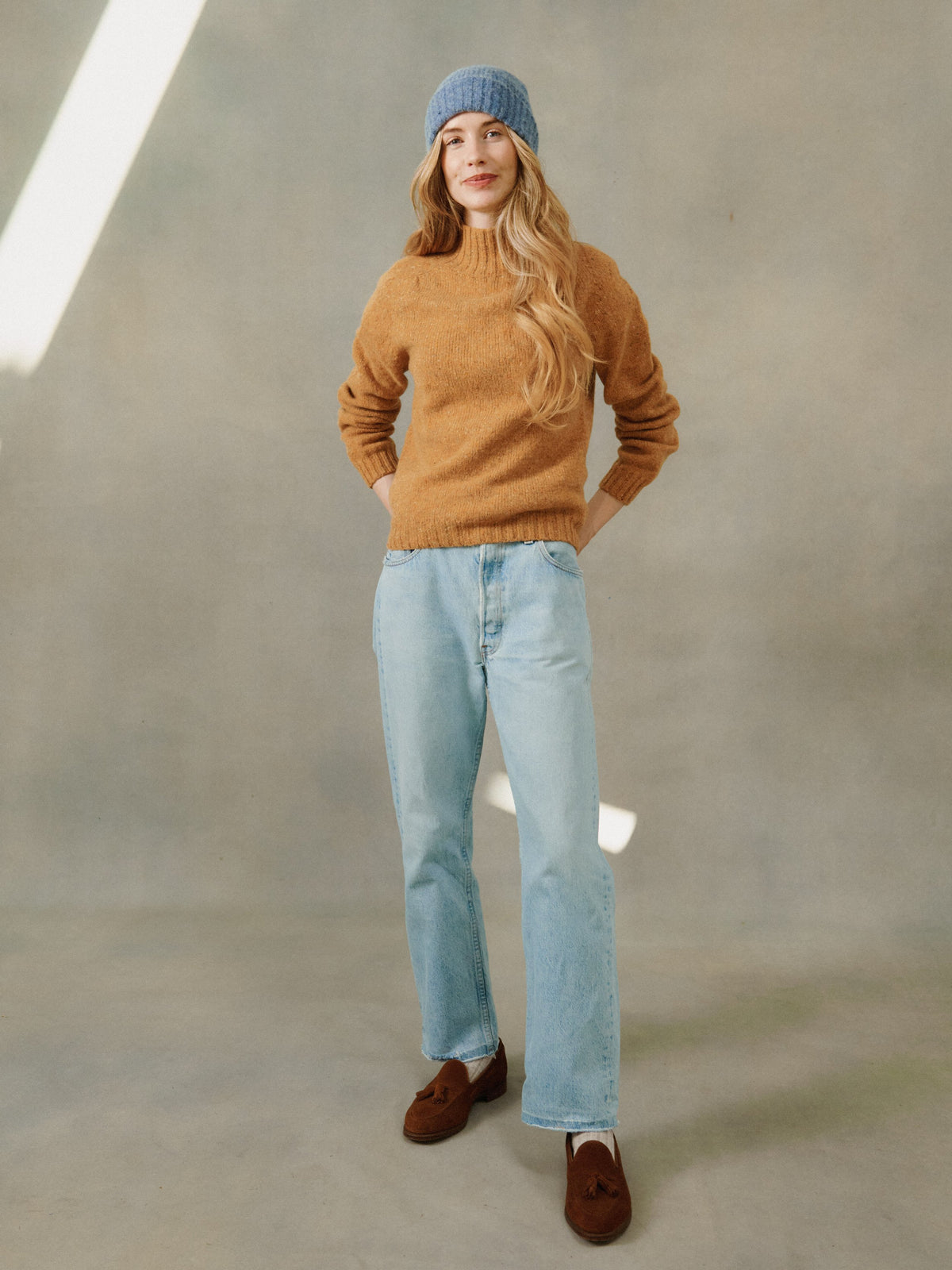 Woman wearing a Bosie women's Glenugie Nep Kintyre funnel neck sweater jumper in Barra Gold