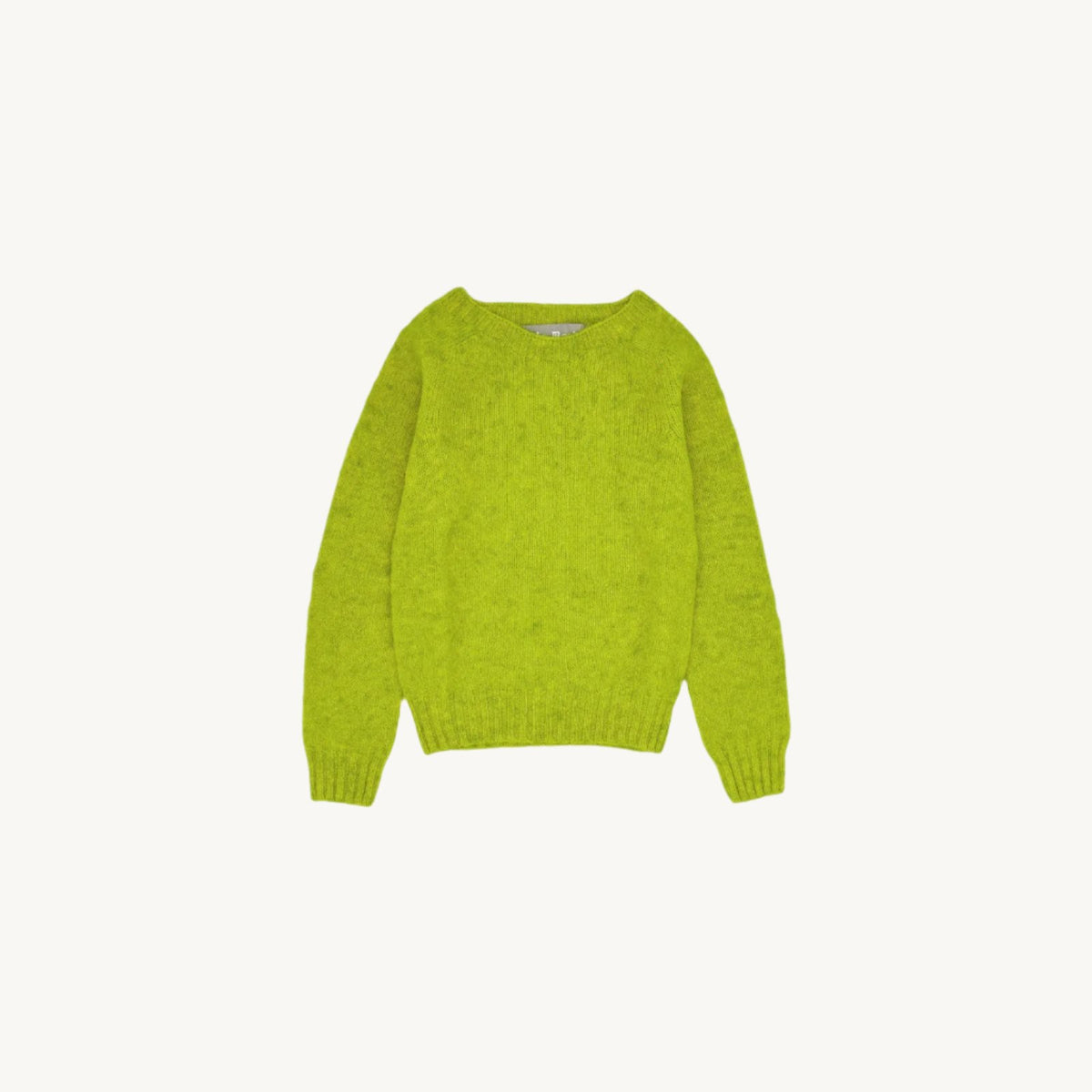 Flatbed photograph of a Bosie Little Bosie Childs Island Shetland Sweater in Pistachio Limon