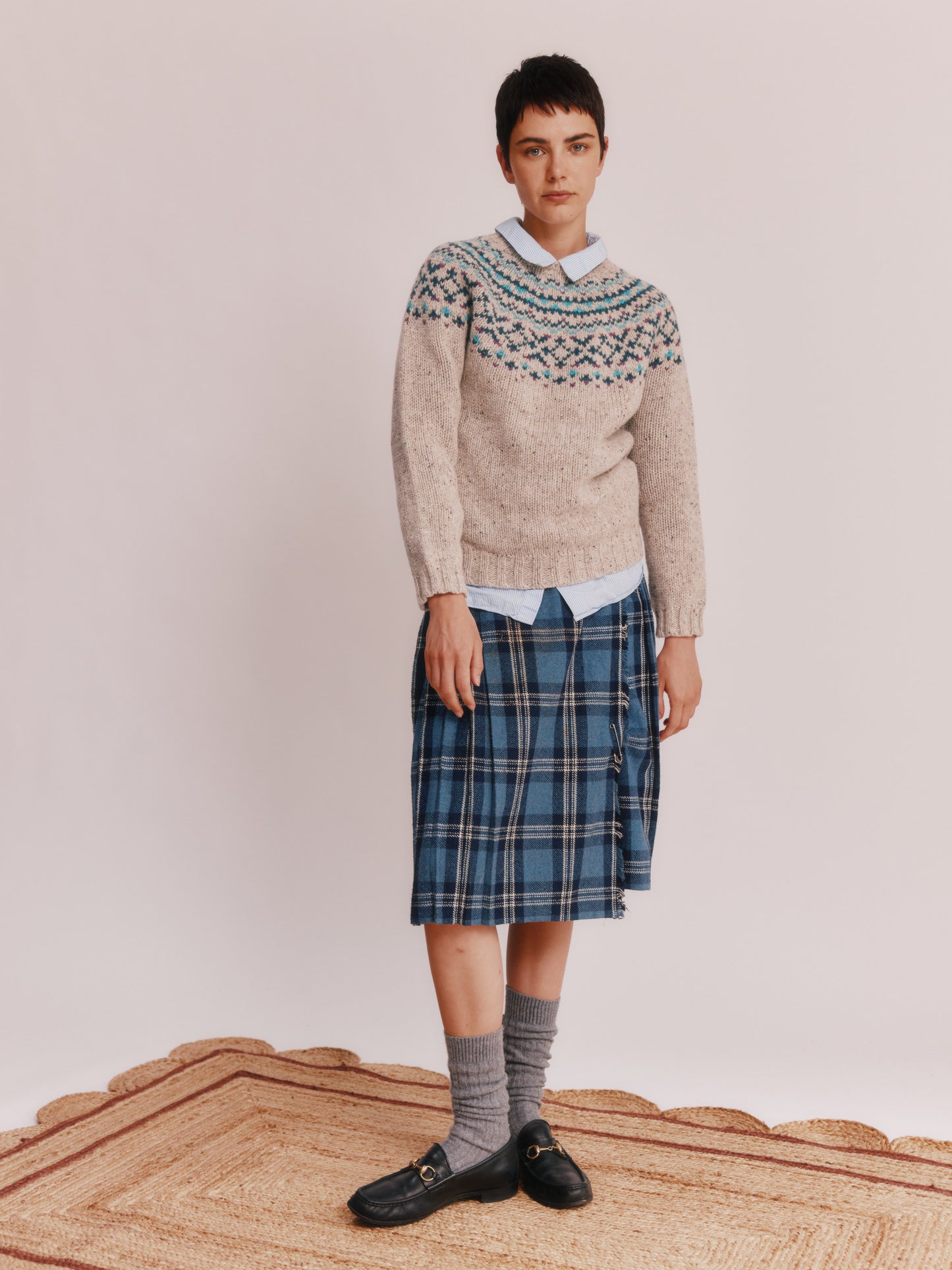 Model wearing a Bosie Knitwear Luskentyre Chunky Fair Isle Glenugie Nep Women's Sweater in colour Mull Natural.
