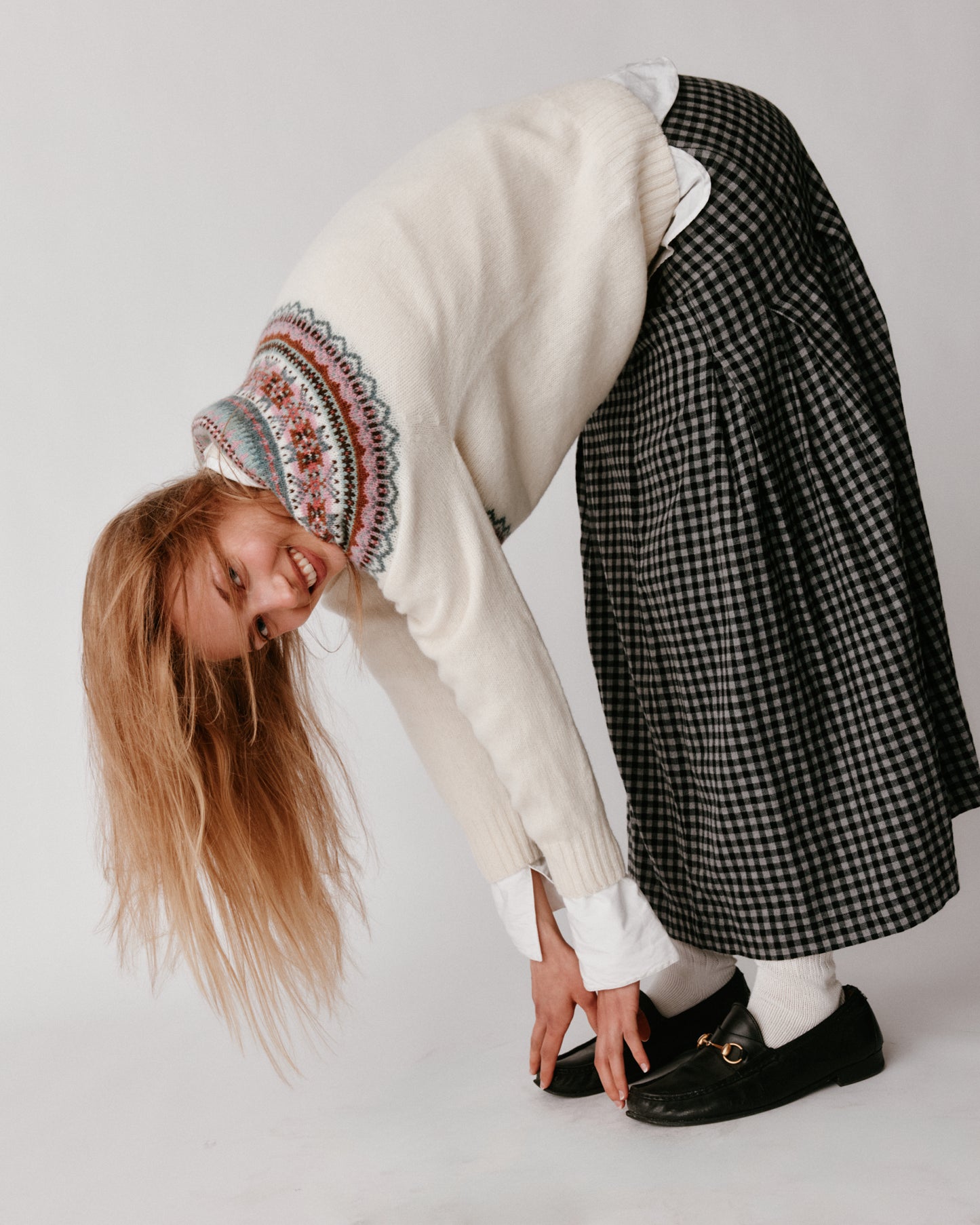 A model wearing a Bosie Sorcha Yoke Fair Isle Women's Sweater in colour White.