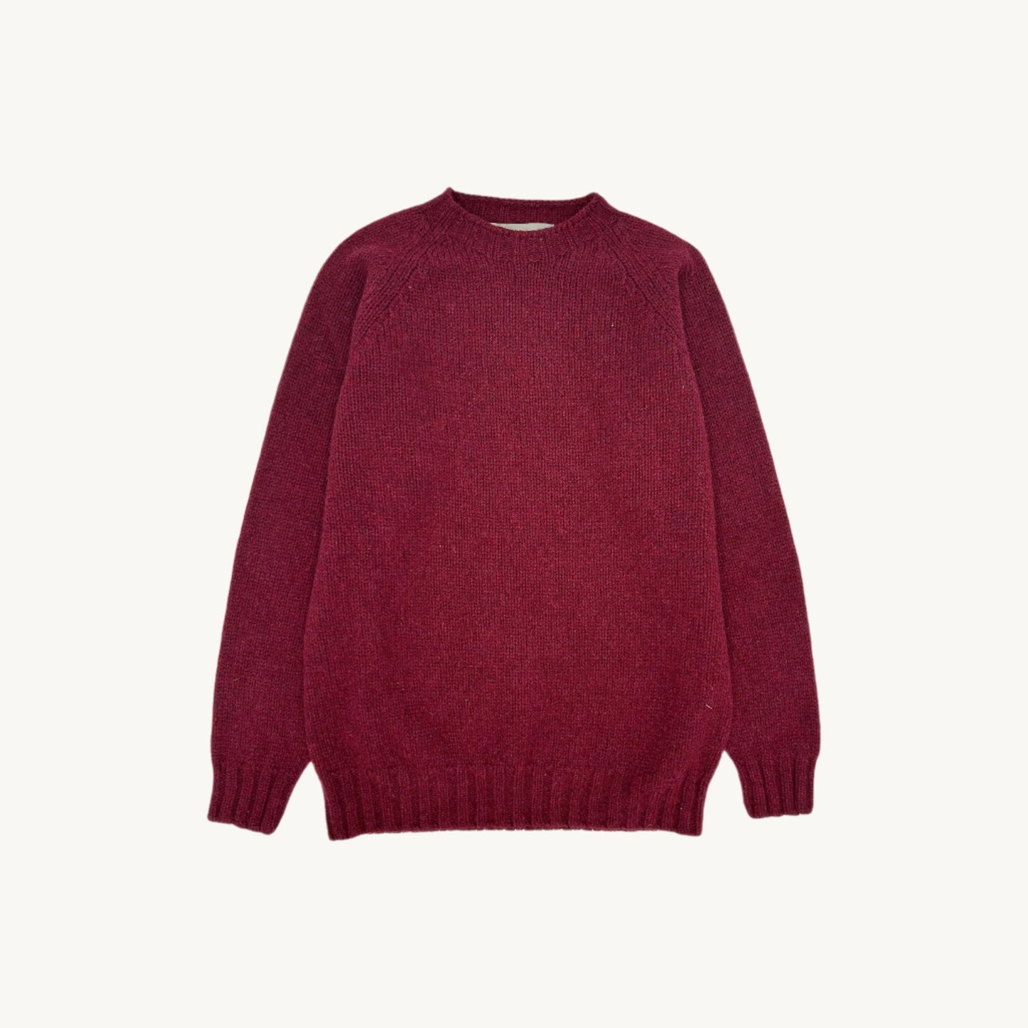 Flatbed Photograph of a Blue Mogganer North Sea Chunky Seamless Supersoft Shetland in Bordeaux mix by Bosie Knitwear