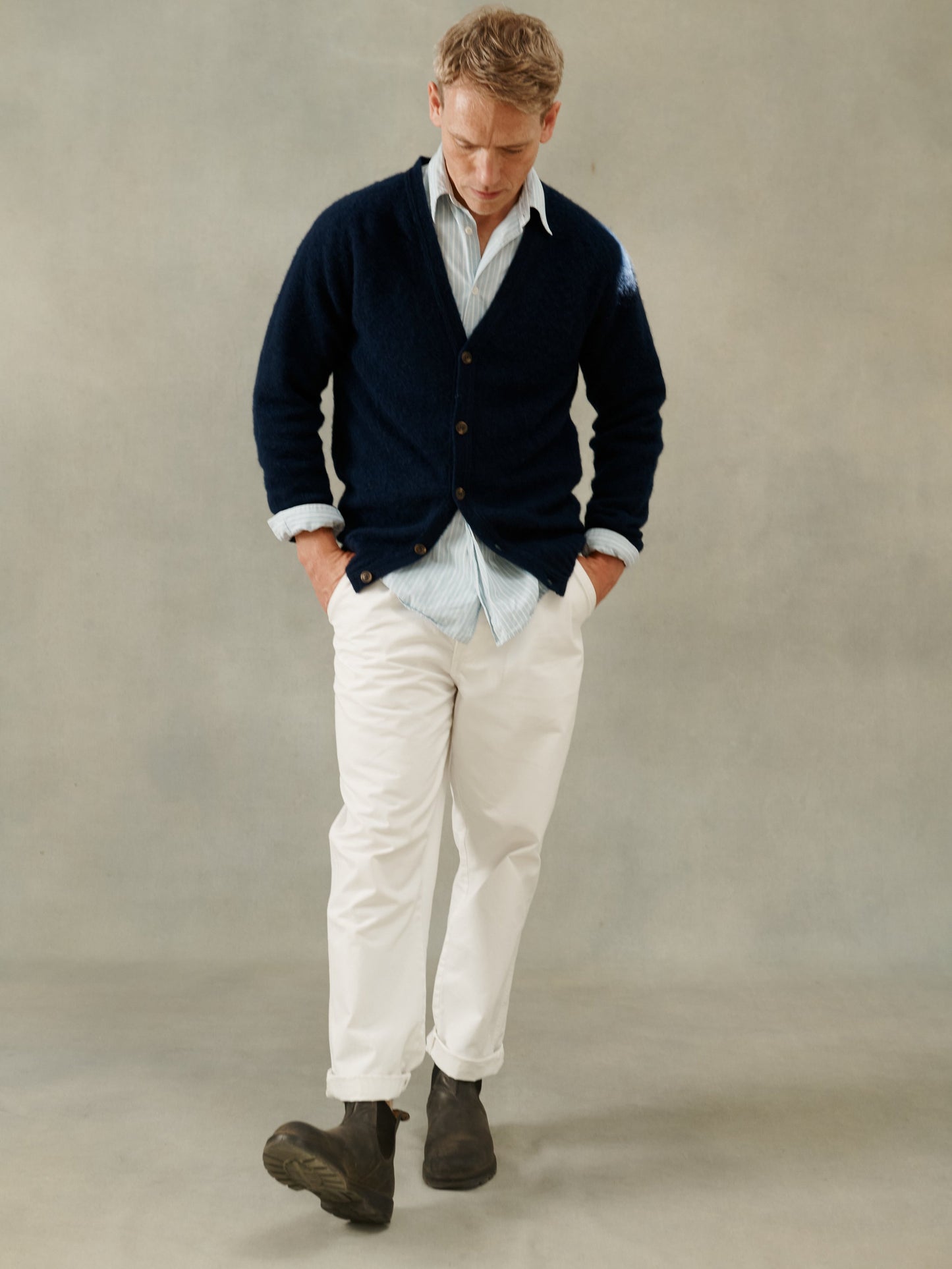 Man wearing a Bosie Knitwear Harley of Scotland seamless saddle shoulder men's Shaggy Brushed Shetland Cardigan in Navycardigan.