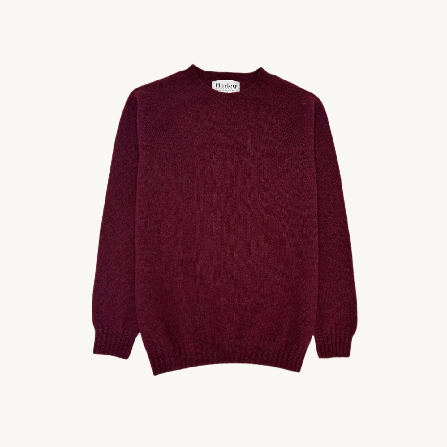 Flatbed Photograph of a Bosie Knitwear Harley of Scotland seamless saddle shoulder men's Shetland sweater jumper in Bordeaux Mix Burgundy