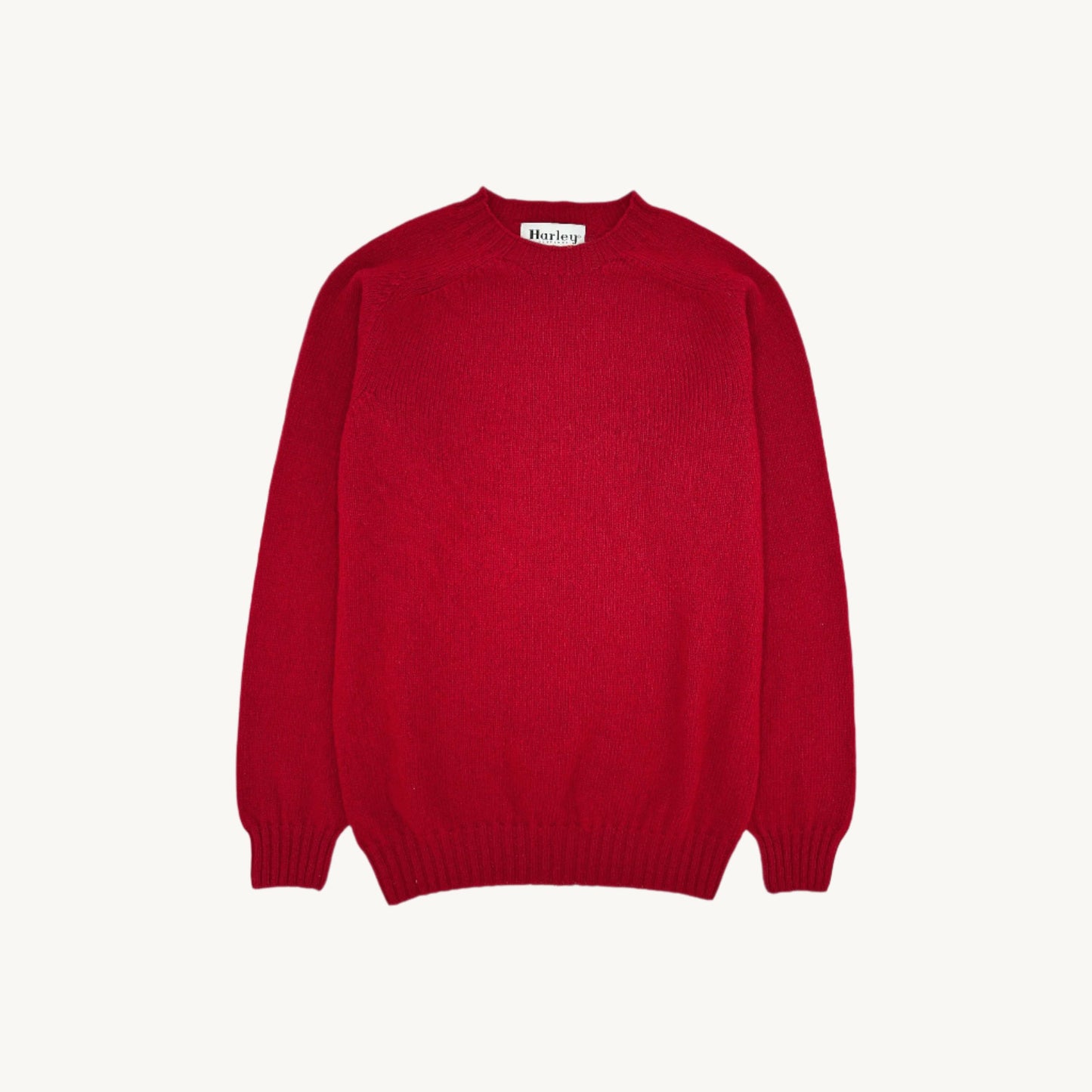 Flatbed Photograph of a Bosie Knitwear Harley of Scotland seamless saddle shoulder men's Shetland sweater jumper in French Red