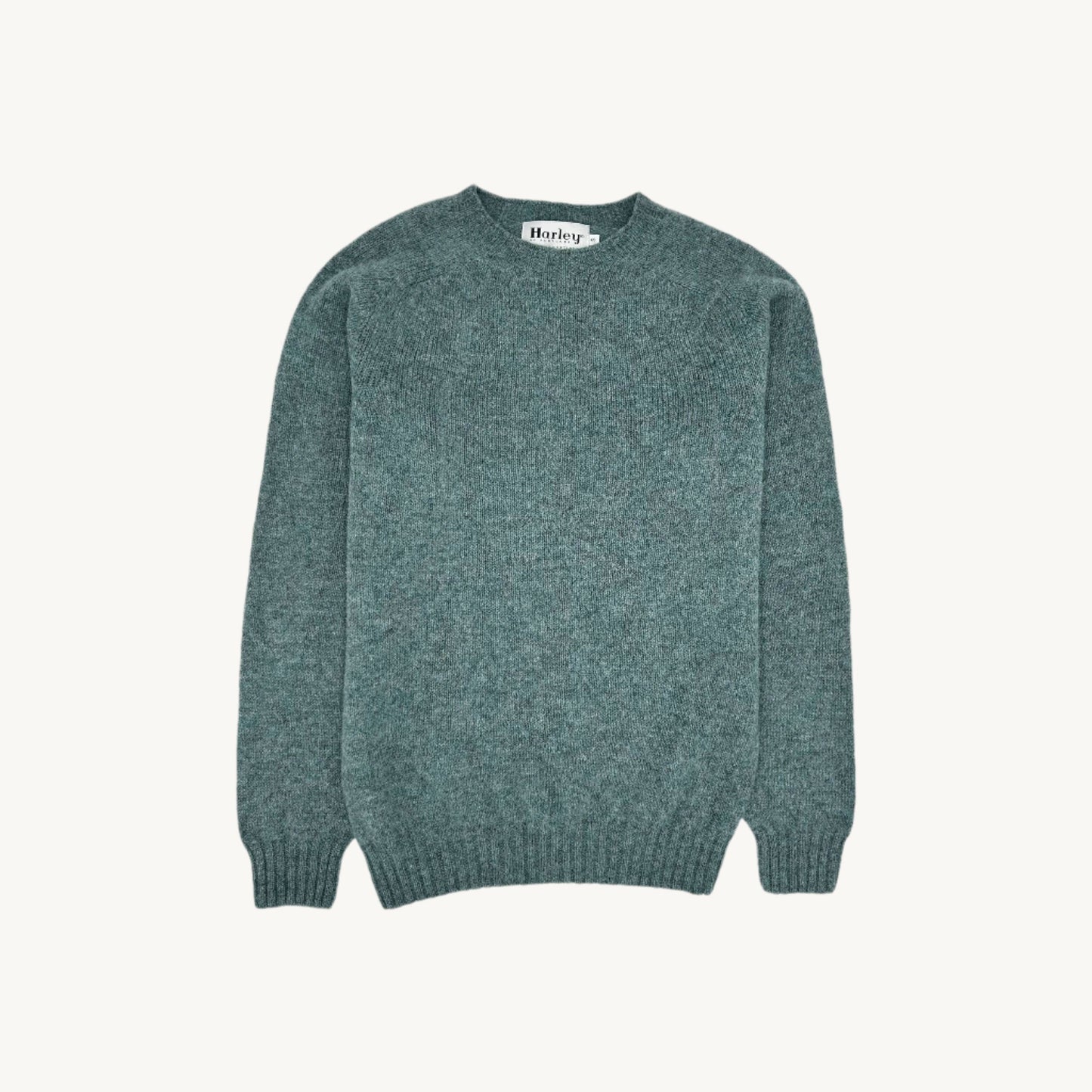 Flatbed Photograph of a Bosie Knitwear Harley of Scotland seamless saddle shoulder men's Shetland sweater jumper in Graphite Green