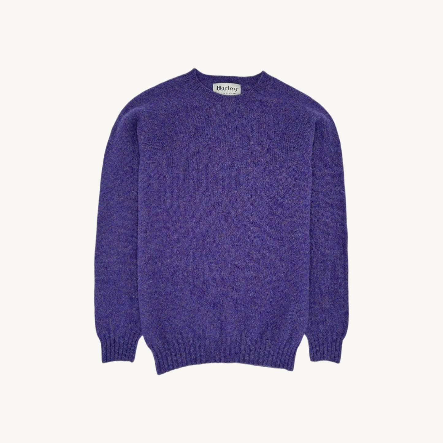 Flatbed Photograph of a Bosie Knitwear Harley of Scotland seamless saddle shoulder men's Shetland sweater jumper in Royal Violet Purple