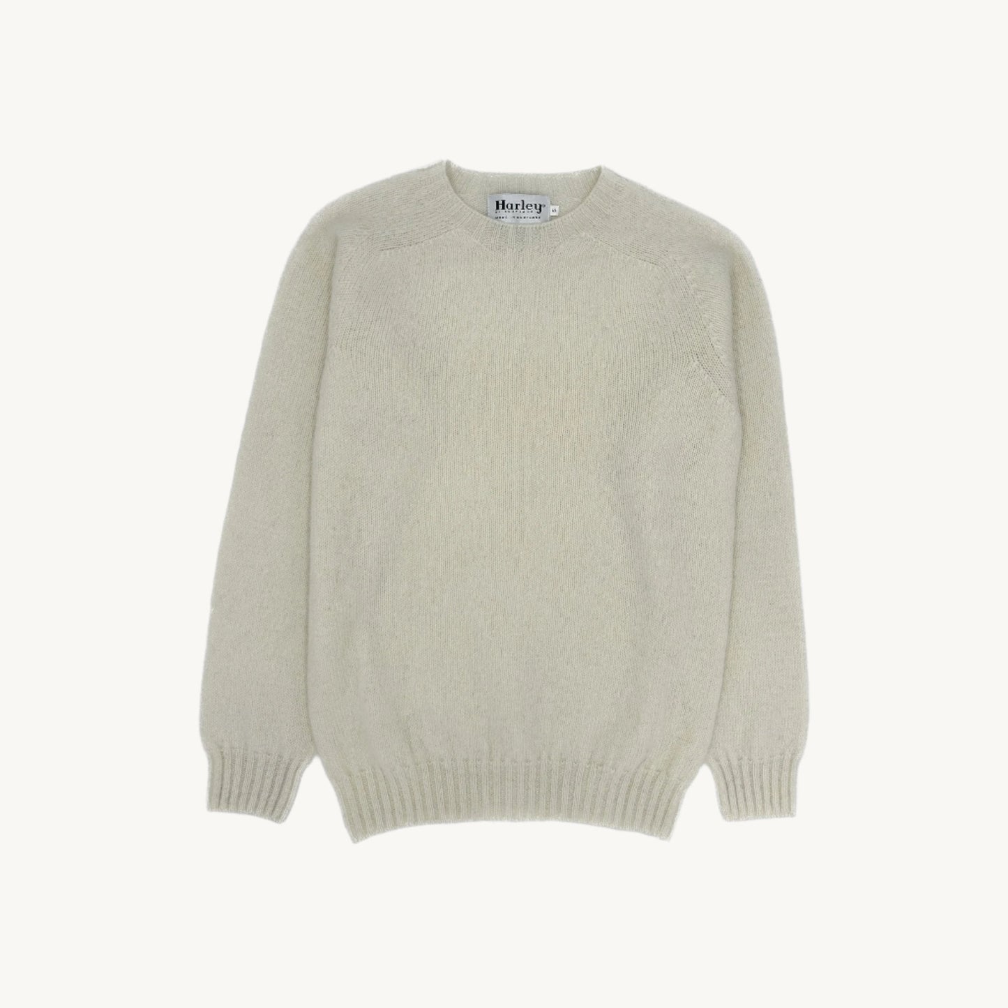 Flatbed Photograph of a Bosie Knitwear Harley of Scotland seamless saddle shoulder men's Shetland sweater jumper in Winter White