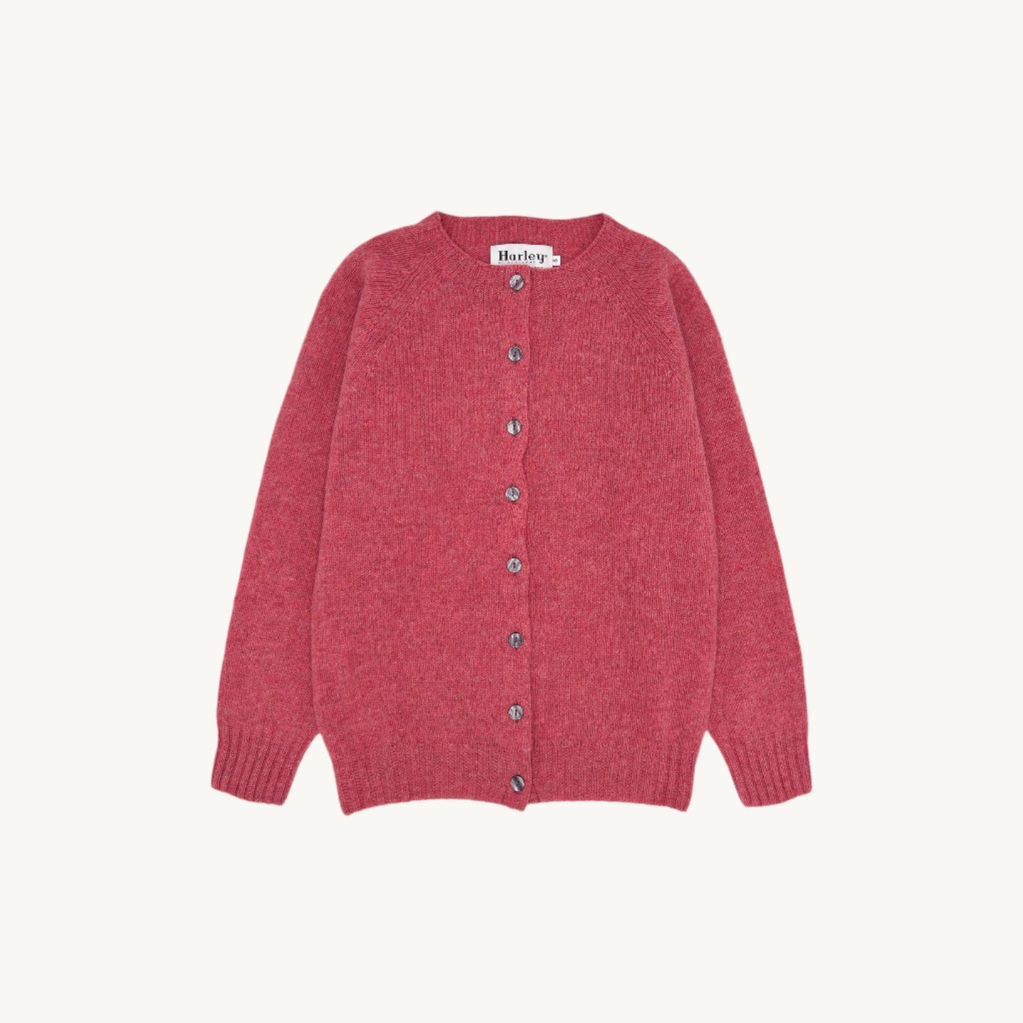 Flatbed Photograph of a Bosie Knitwear Harley of Scotland seamless saddle shoulder women's Shetland Cardigan in Rosebud Pink