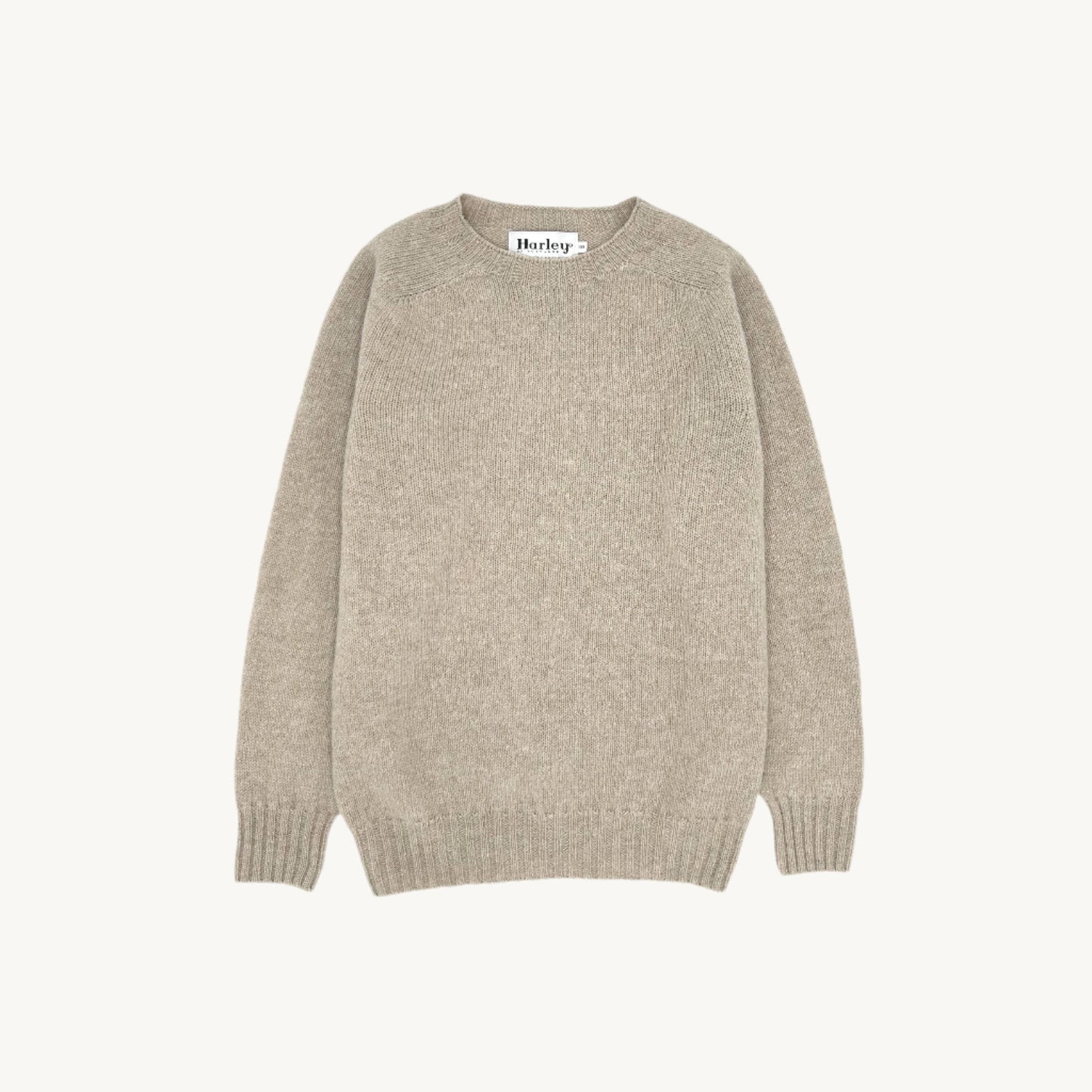 Flatbed Photograph of a Bosie Knitwear Harley of Scotland seamless saddle shoulder women's Shetland sweater jumper in Oatmilk Beige