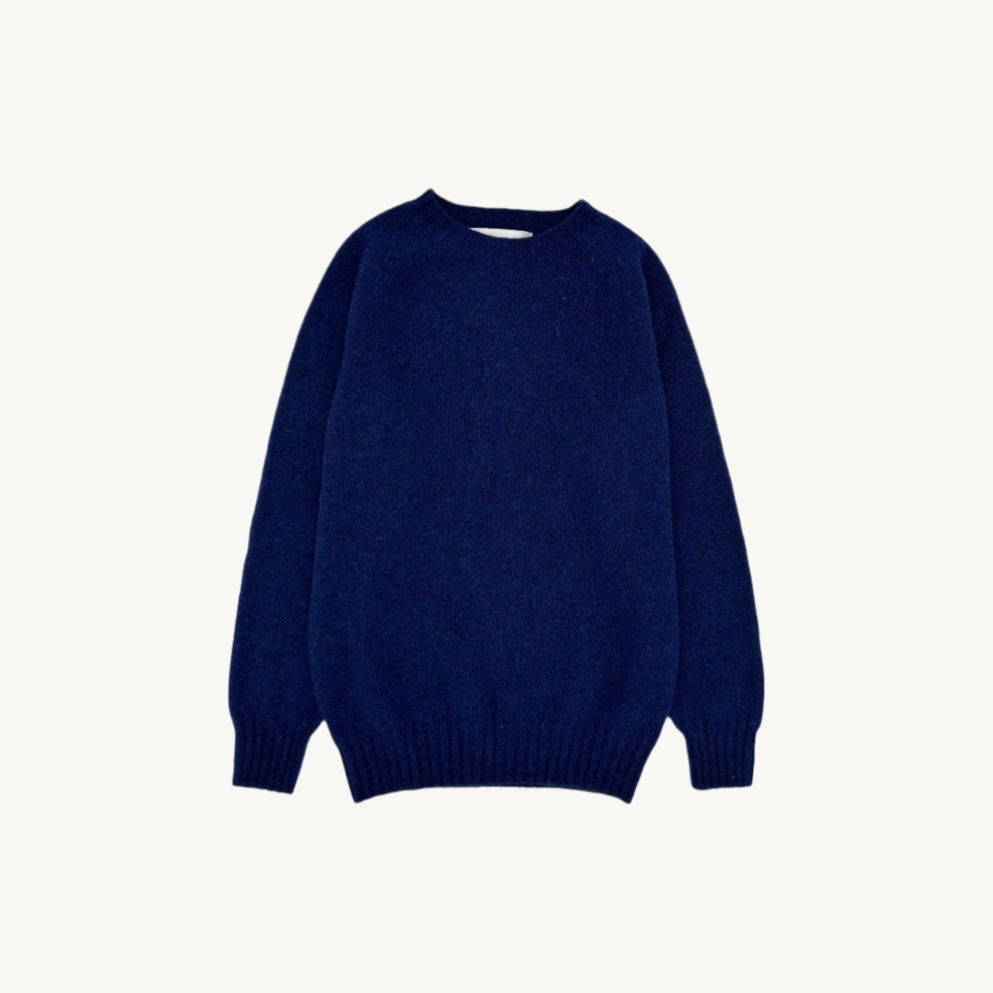 Flatbed Photograph of a Bosie Knitwear Harley of Scotland seamless saddle shoulder women's Shetland sweater jumper in Starnight Blue Navy