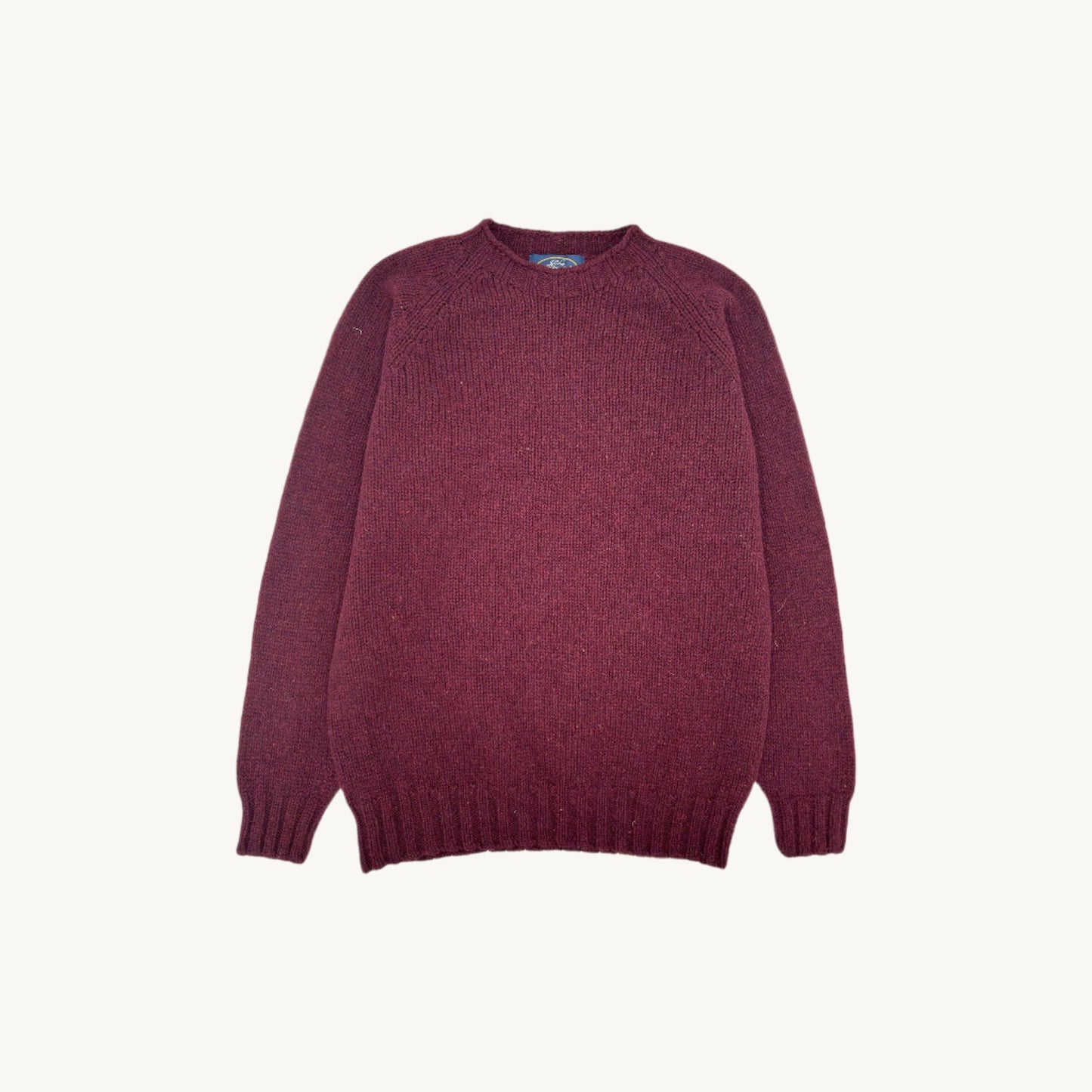 Flatbed Photograph of a Blue Mogganer North Sea Chunky Seamless Supersoft Shetland in dark cranberry burgundy by Bosie Knitwear