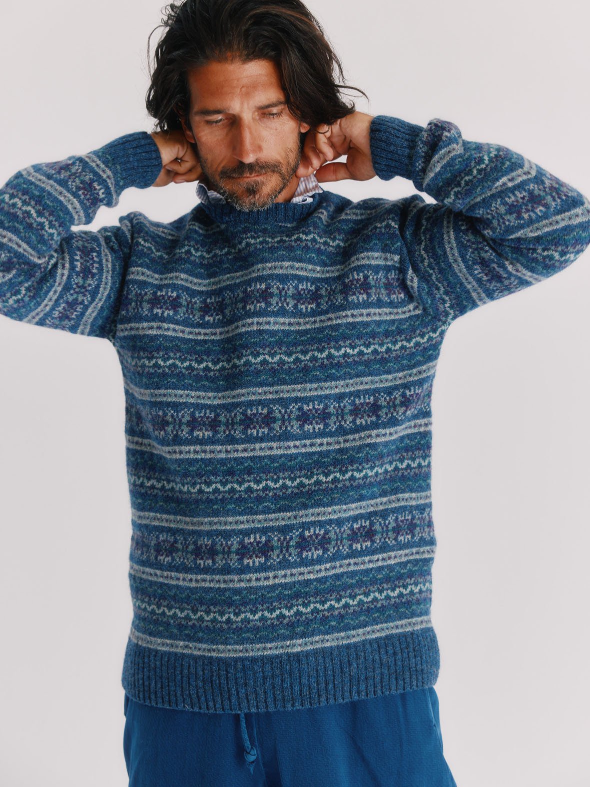 Man wearing a Blue Mogganer Port Errol allover fairisle in lambswool by Bosie Knitwear