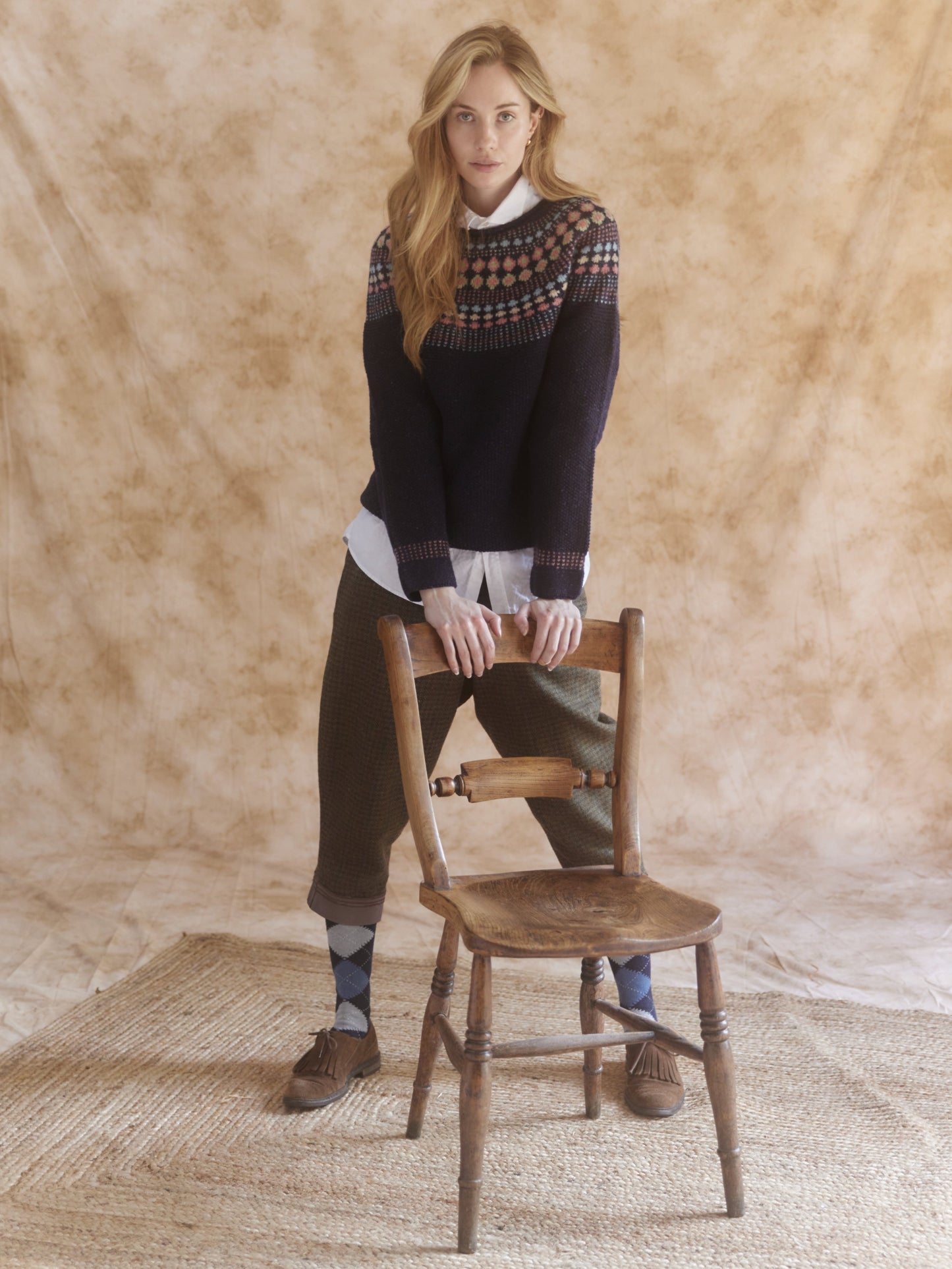 Woman wearing a Jura Navy Bosie Shieling Glenugie Nep Fairisle Moss Stitch Yoke Sweater