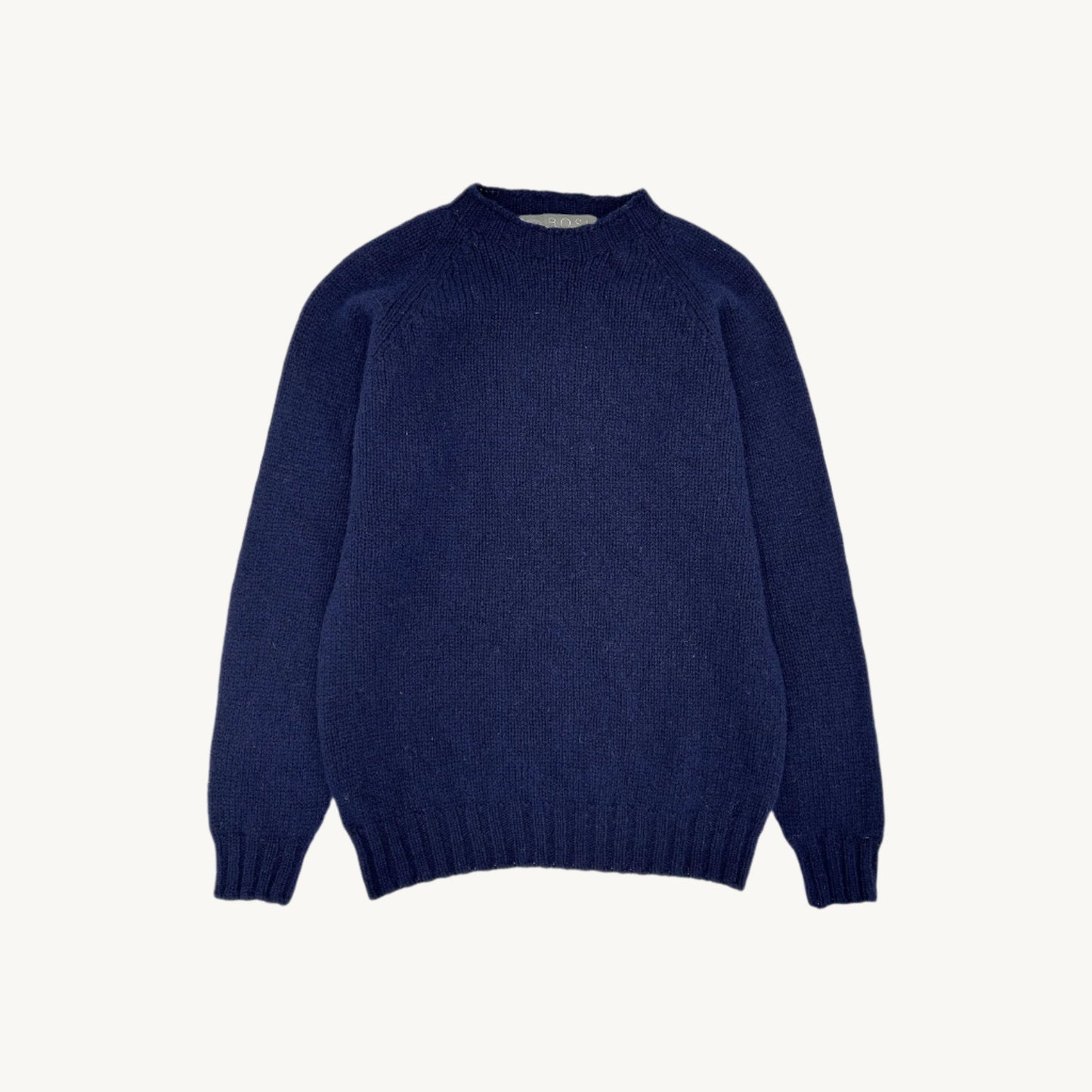 Flatbed Photograph of a Blue Mogganer North Sea Chunky Seamless Supersoft Shetland in navy by Bosie Knitwear