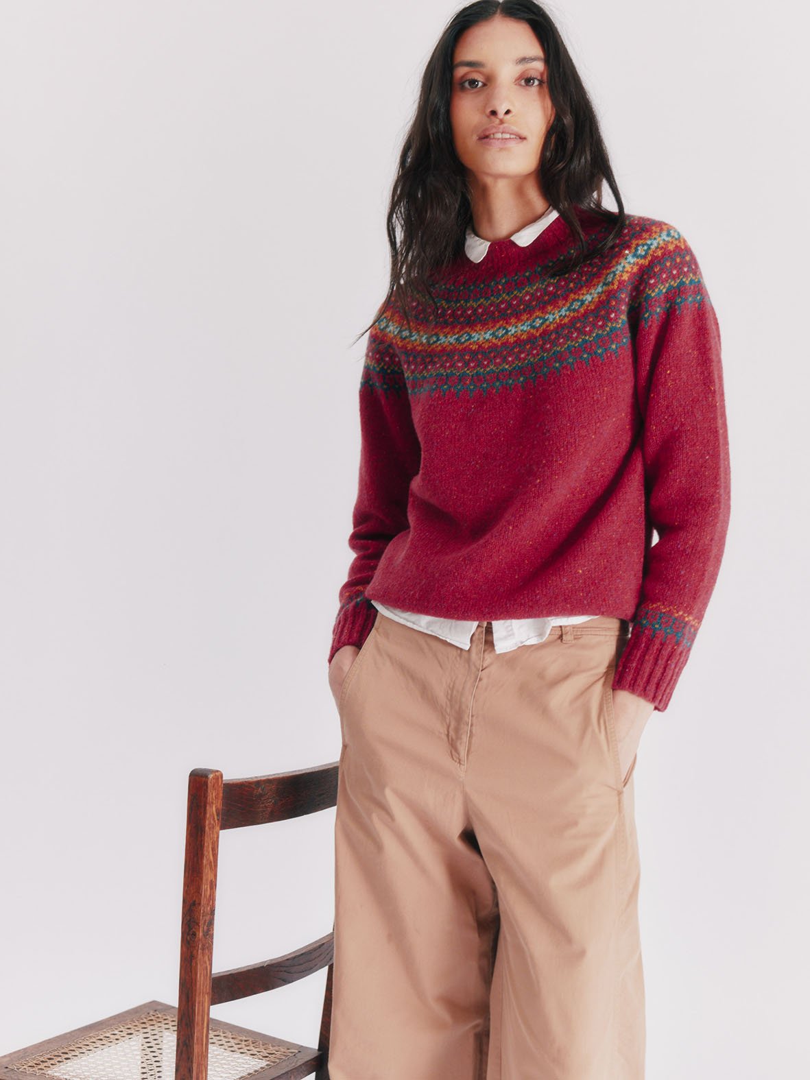 Woman wearing a Oronsay Red Bosie Islander Glenugie Nep Fairisle Yoke Sweater