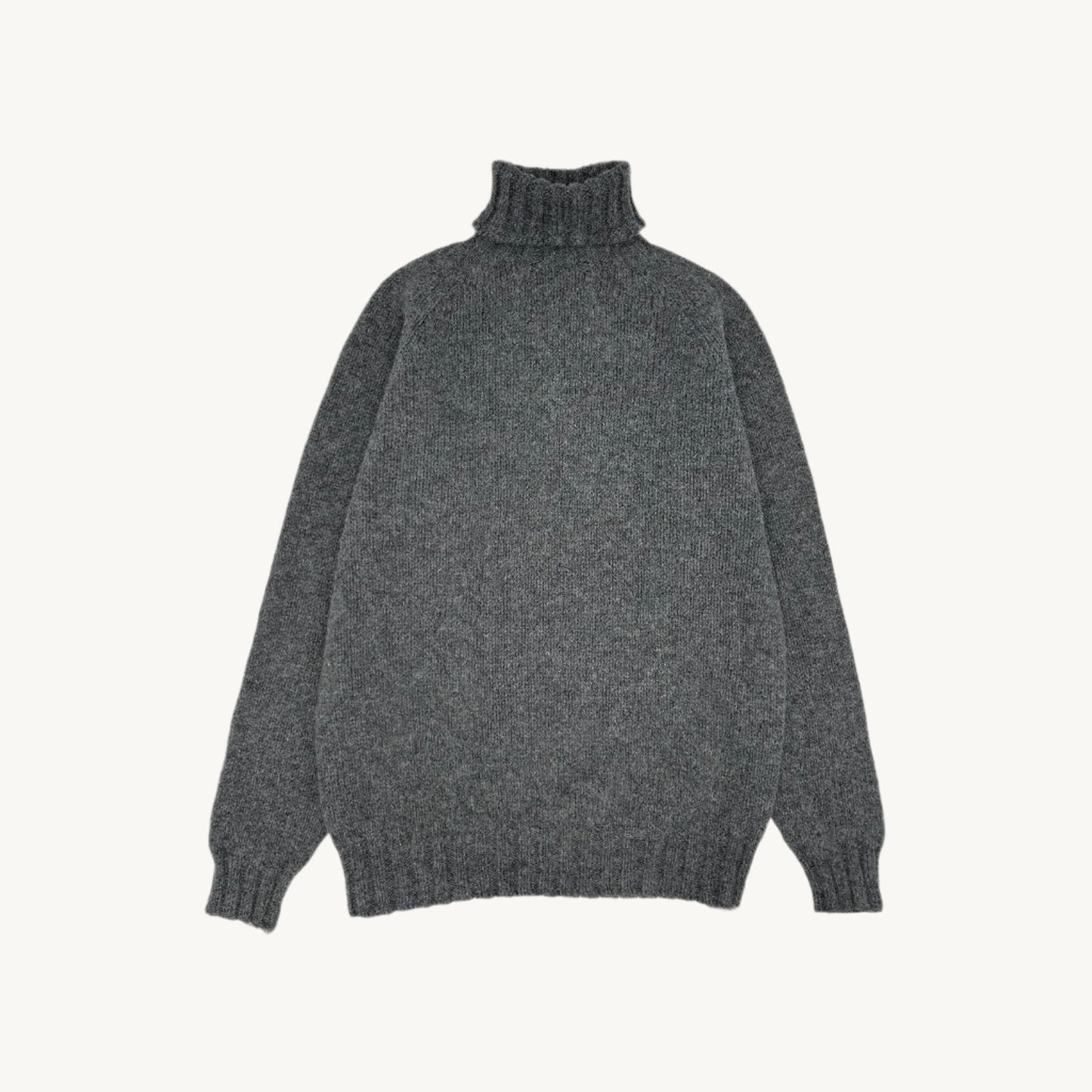Flatbed Photograph of a Blue Mogganer Submariner Polo Neck Shetland Chunky Sweater in Oxford Grey by Bosie Knitwear