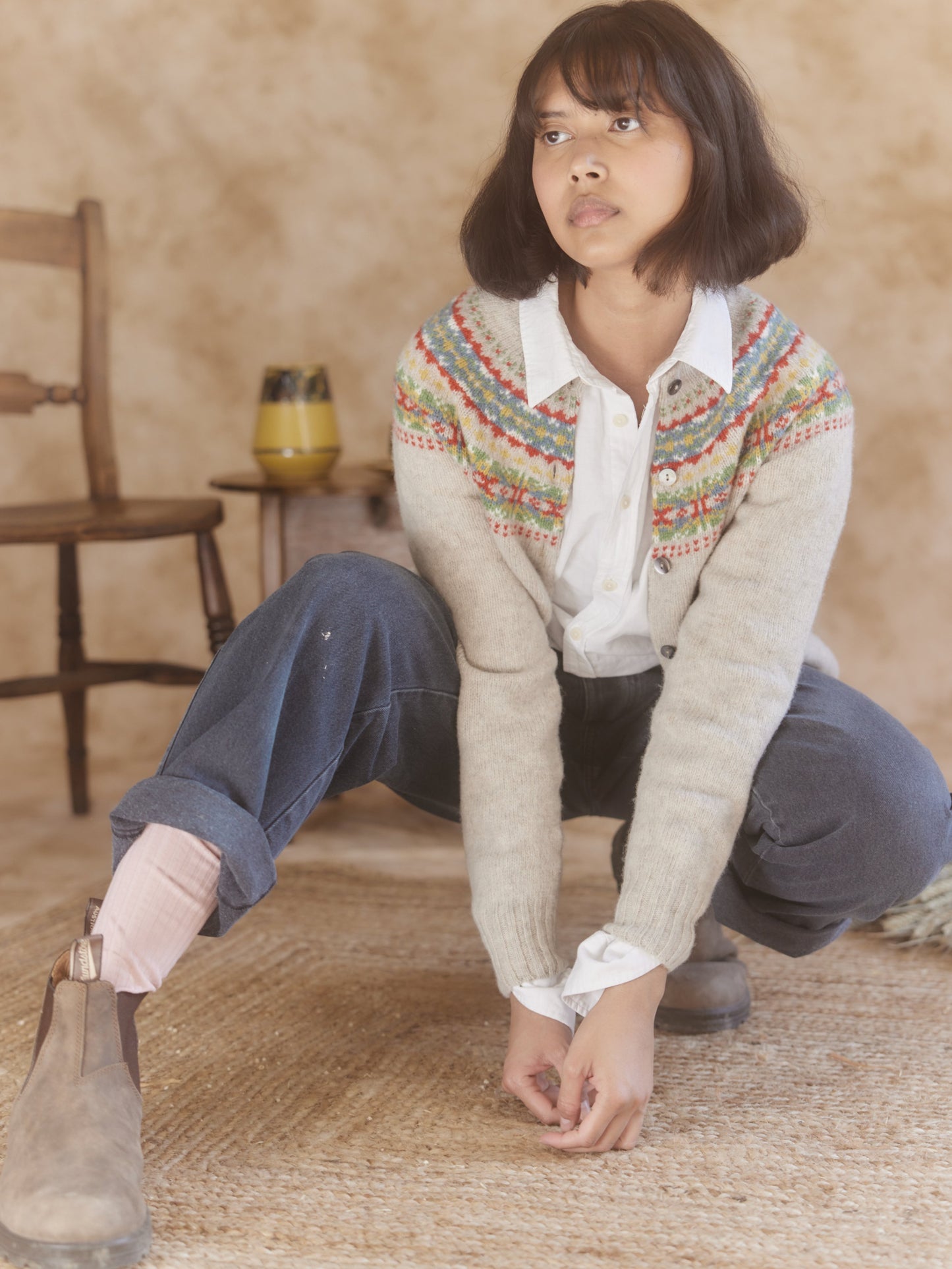 Woman wearing a putty natural Bosie Skye Lambswool Fairisle Yoke Cardigan