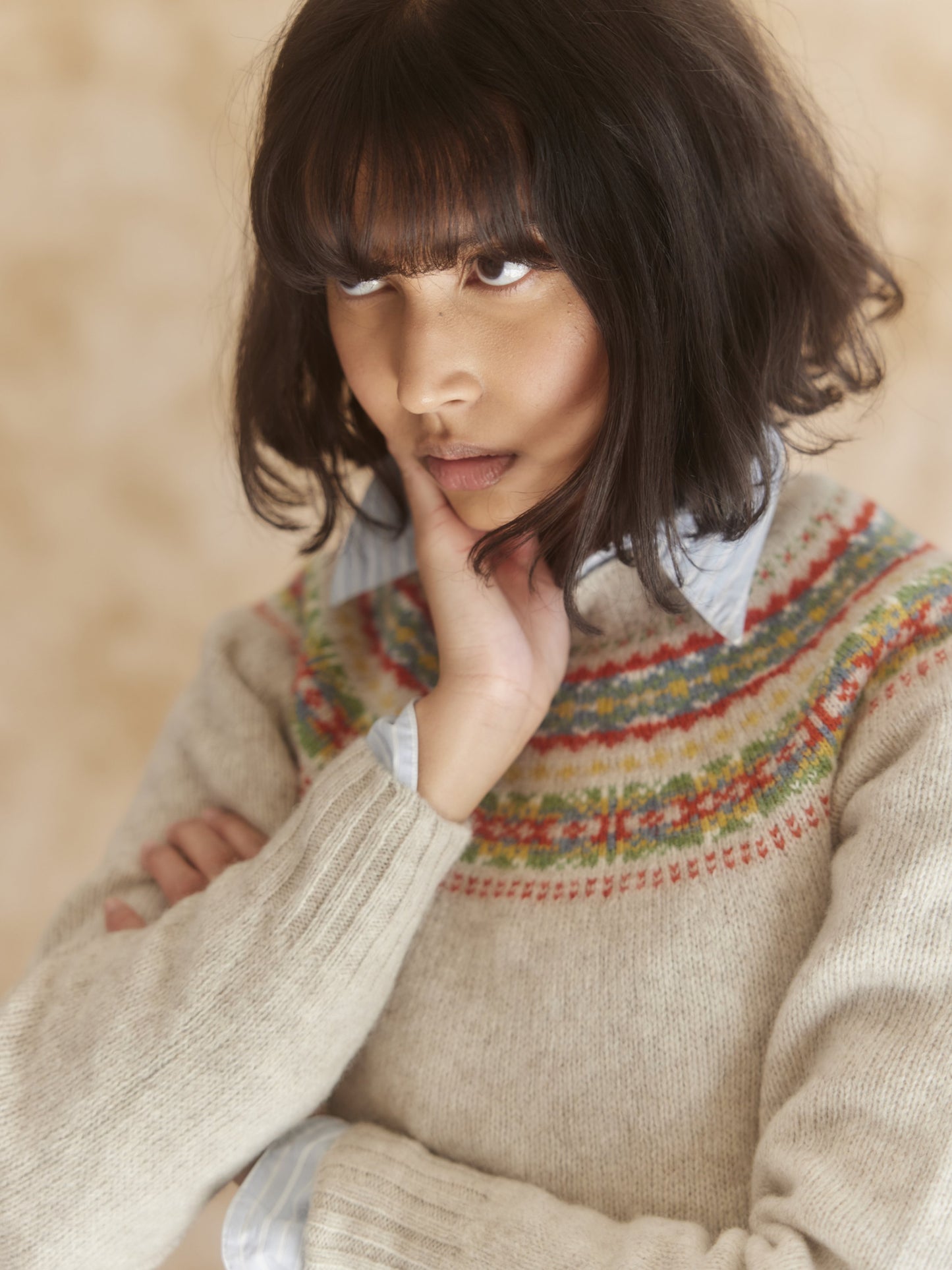 Woman wearing a putty natural Bosie Skye Lambswool Fairisle Yoke Sweater
