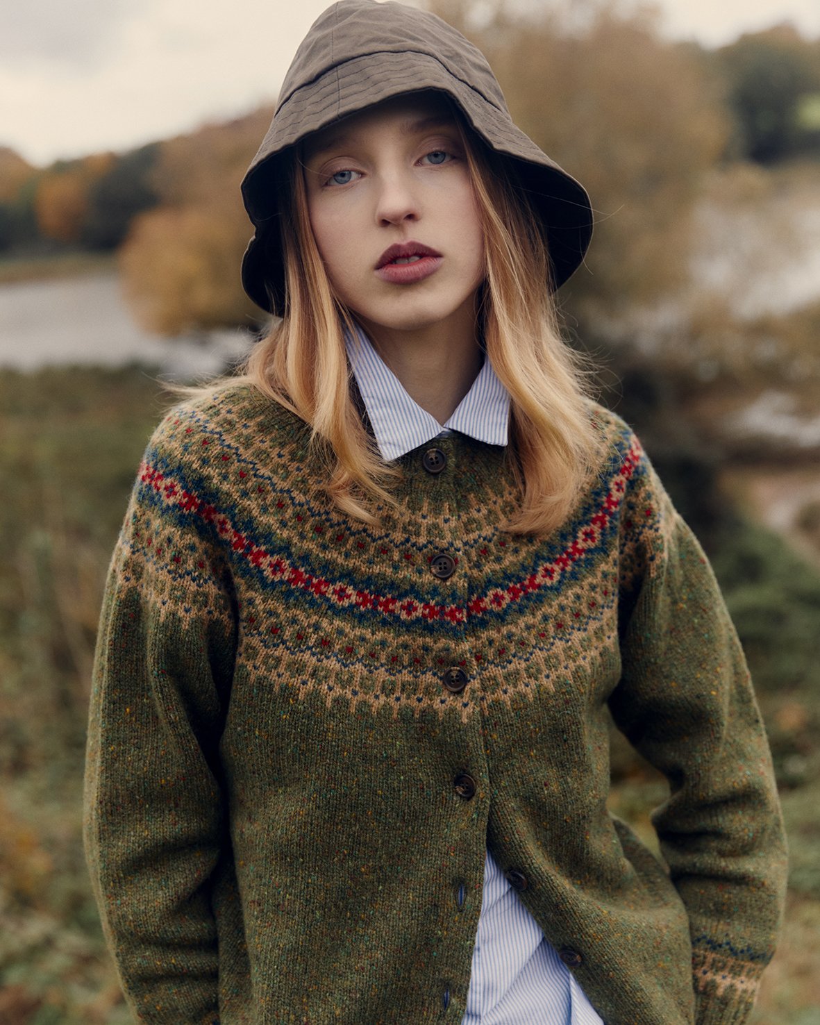 Woman wearing a raasay green Bosie Islander Glenugie Nep Fairisle Yoke Cardigan