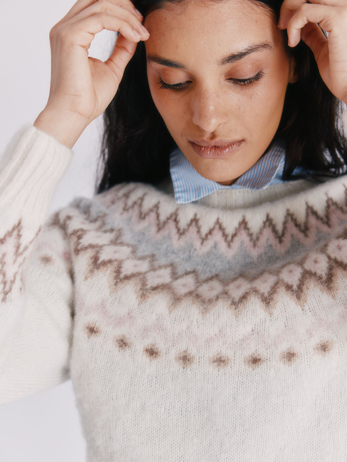 Woman wearing a winter white brushed Bosie Fjord Fairisle lambswool Sweater