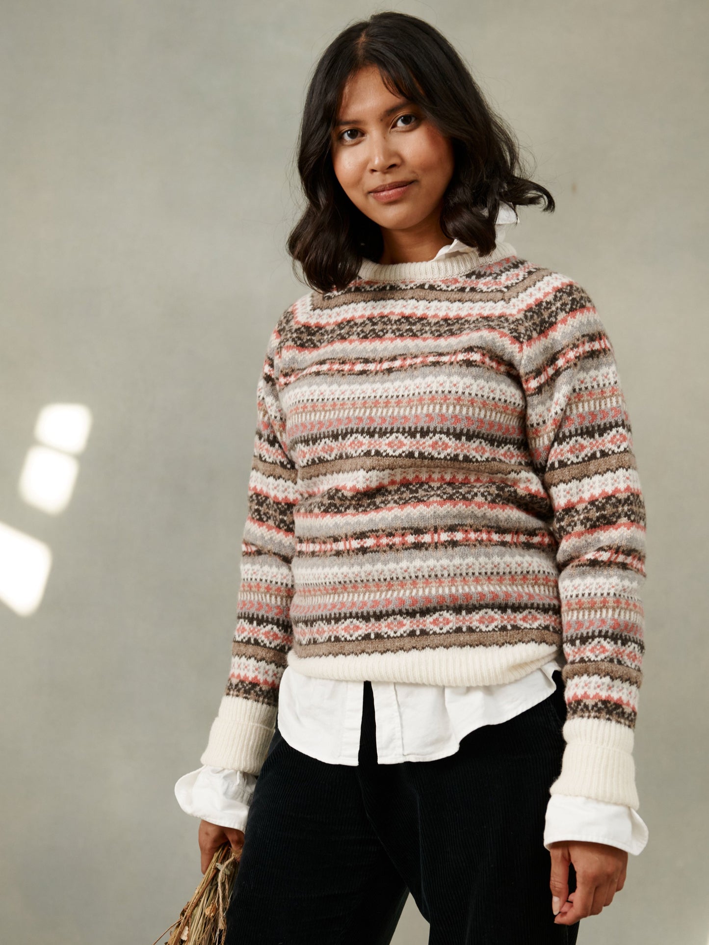 Woman wearing a winter white Bosie Knitwear Queenie allover fair isle lambswool sweater jumper