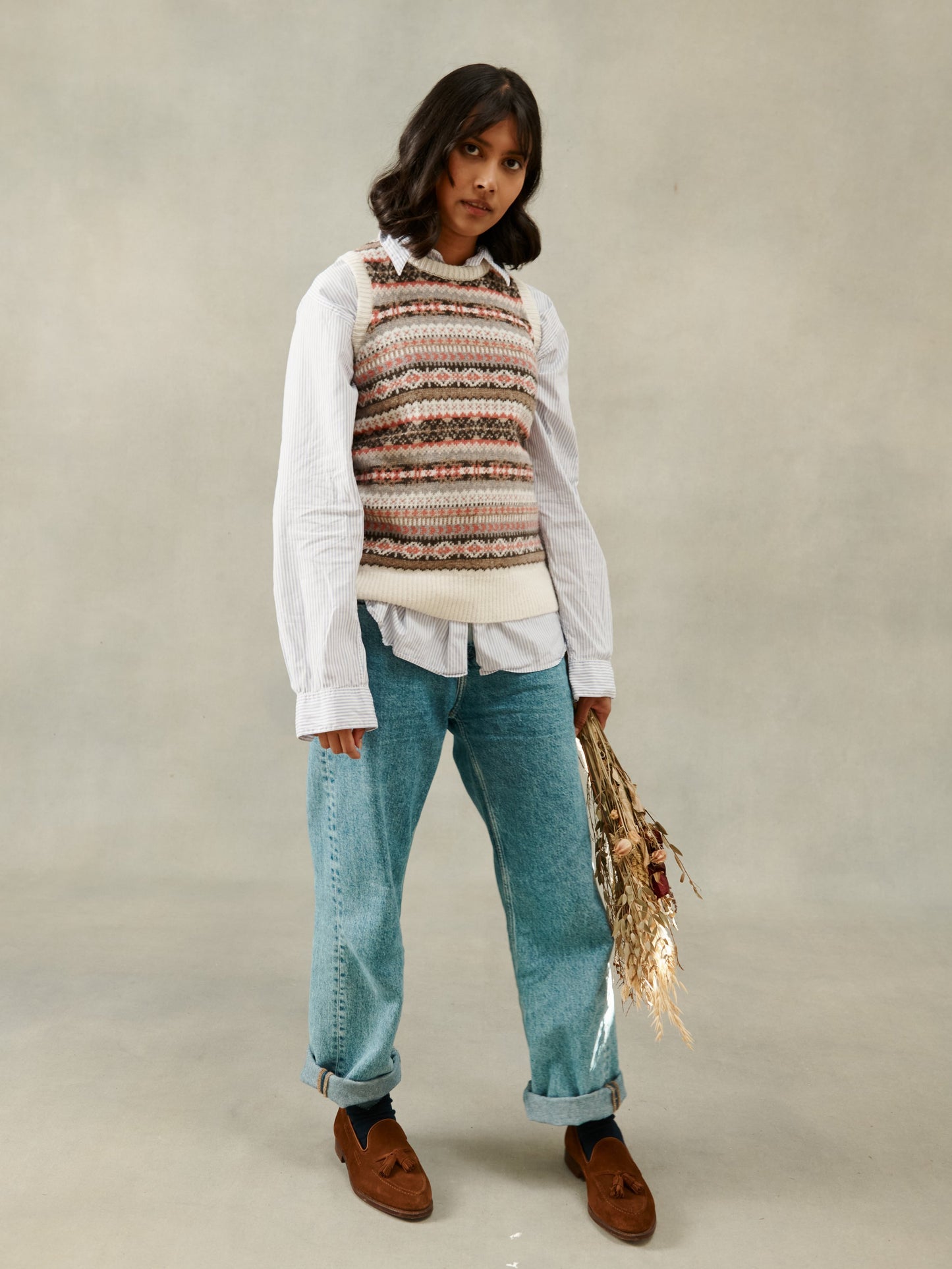 Woman wearing a winter white queenie allover bosie fairisle slipover vest