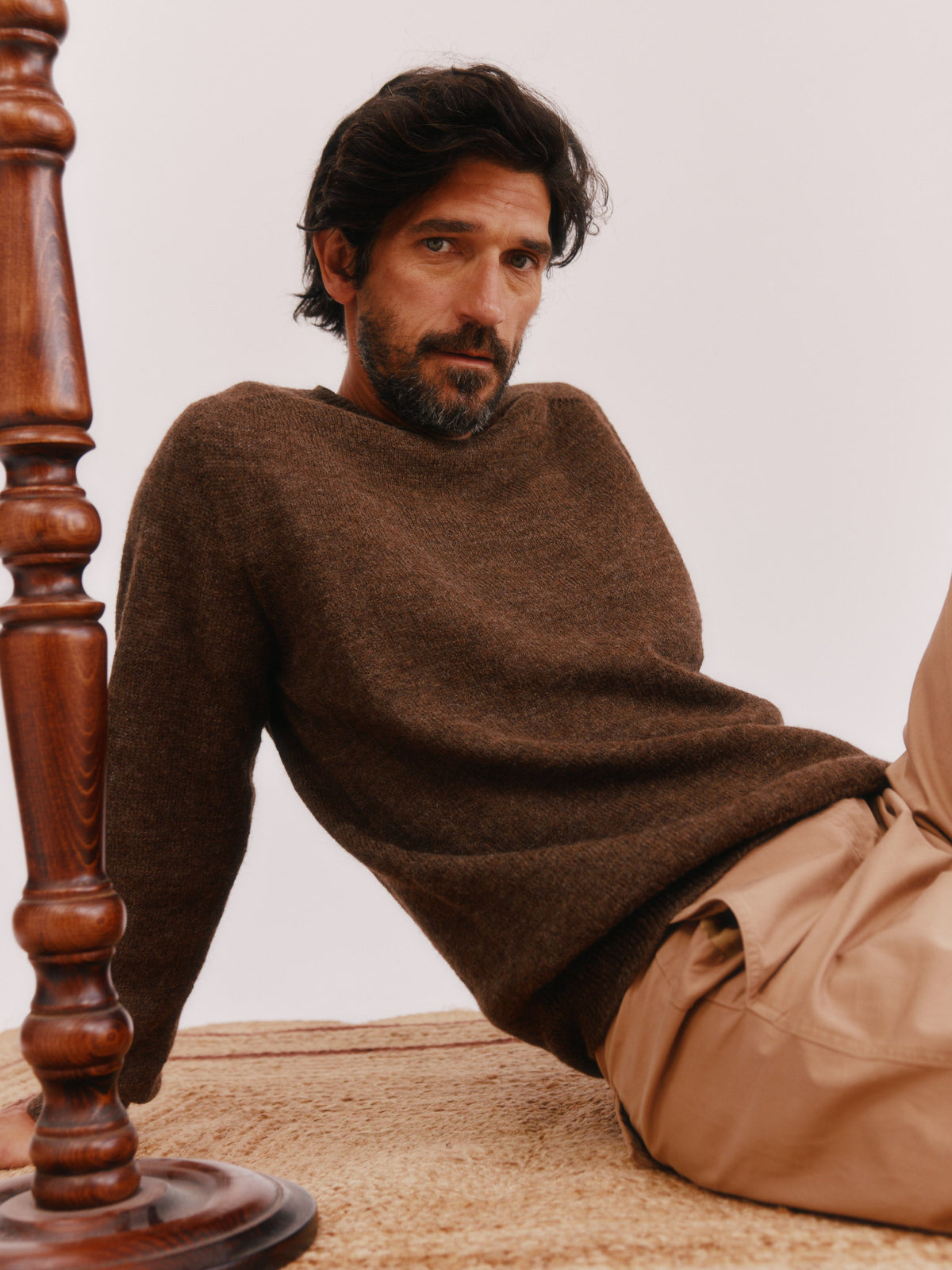 Man wearing the Bosie Everest Undyed Voe Shetland in Moorit Brown, knitted in Scotland