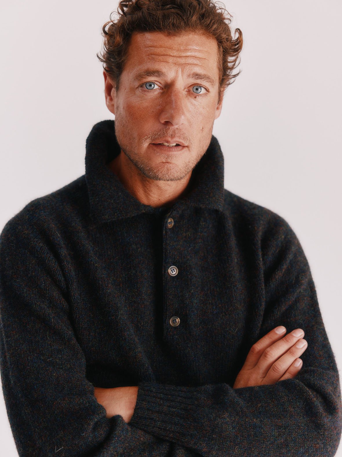Man in an Eton Collar Harley of Scotland Shetland Sweater Jumper in Midnight Black by Bosie Knitwear