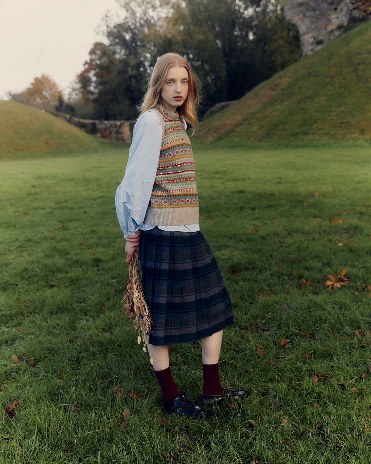Woman wearing a Bosie Knitwear Queenie lambswool fair isle slipover vest in Putty Natural.