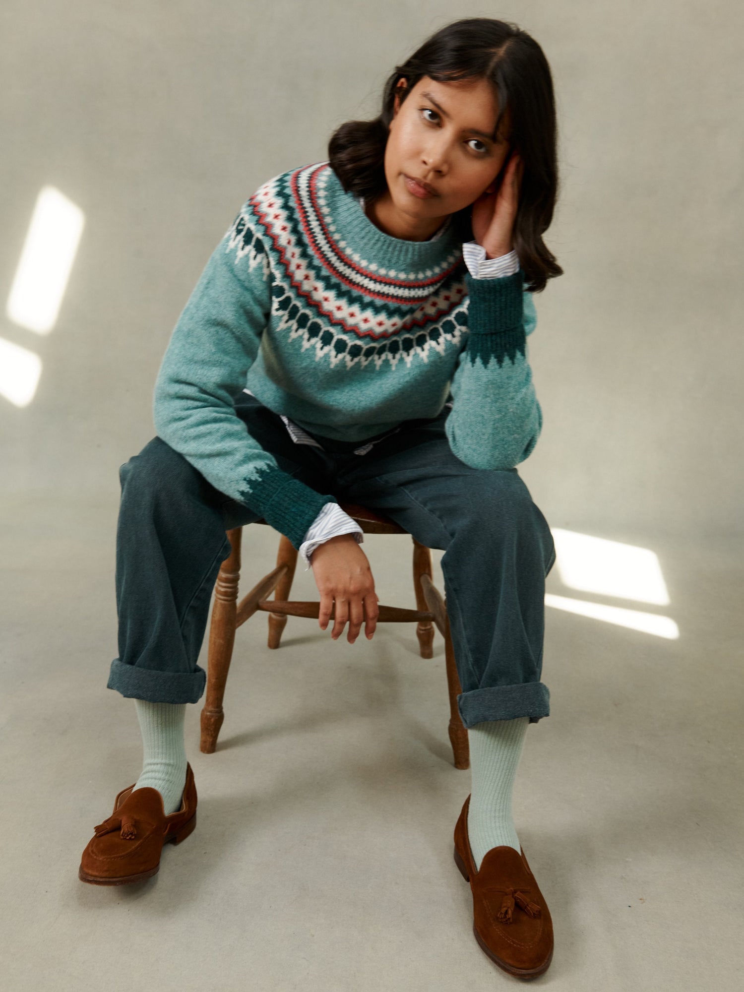Woman in a Bosie Knitwear Astrid Fair Isle Sweater Nordic Jumper in Oribe Warm Blue by Bosie Knitwear
