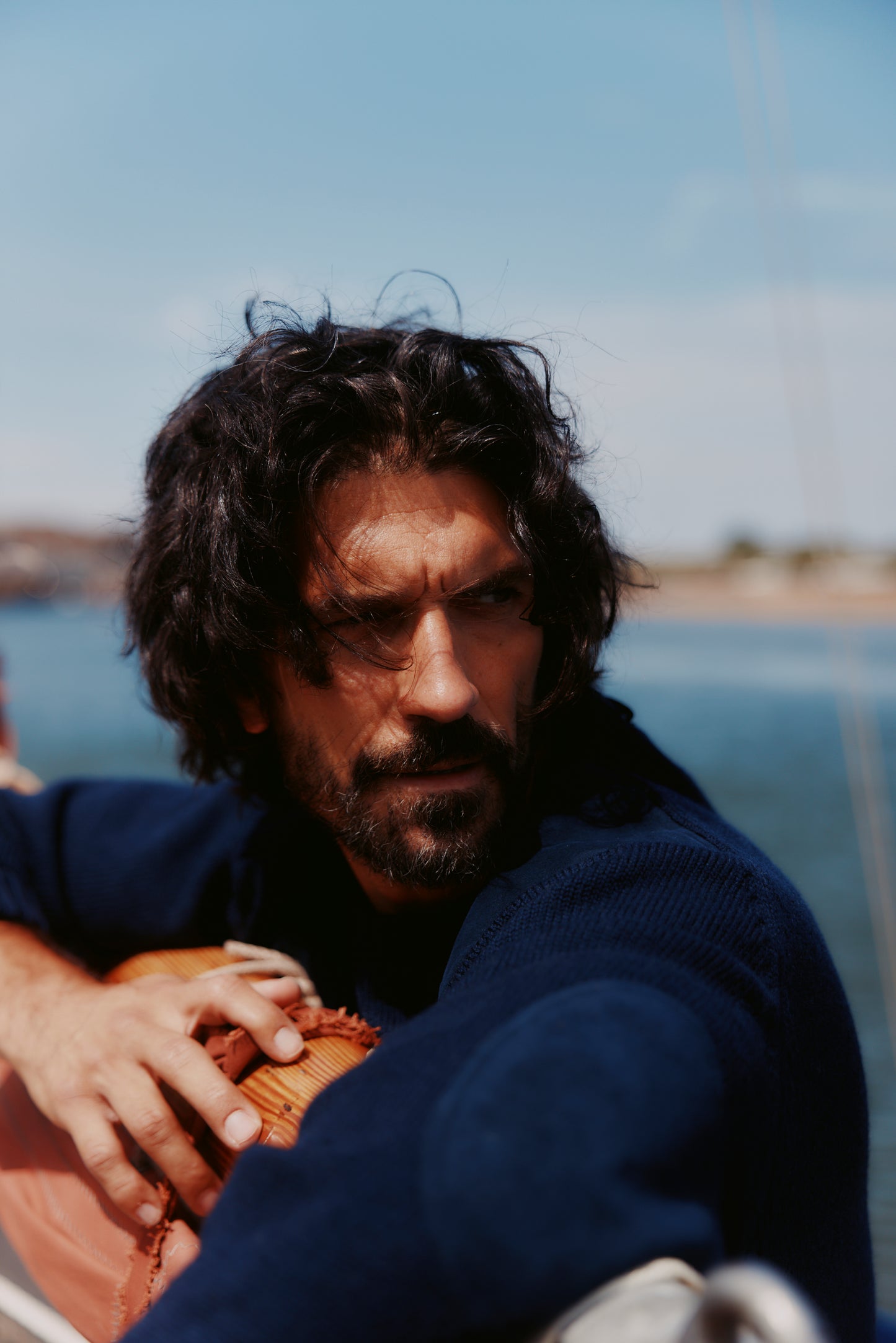 Man in a Bosie Blue Mogganer Navigator Sweater in Navy