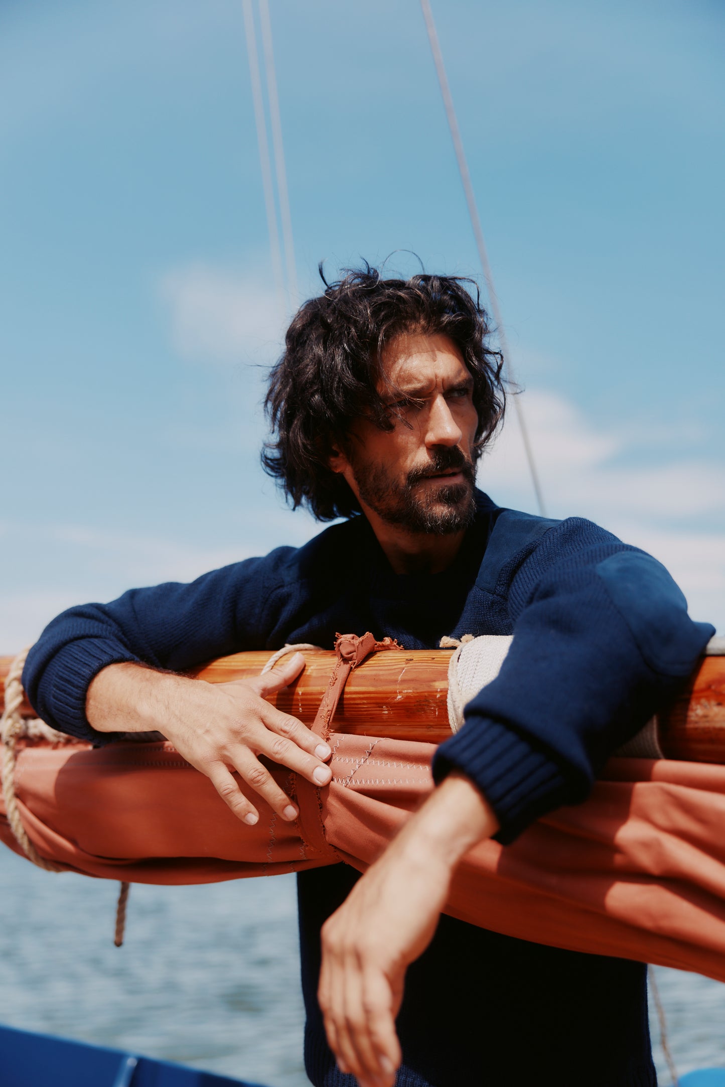 Man in a Bosie Blue Mogganer Navigator Sweater in Navy