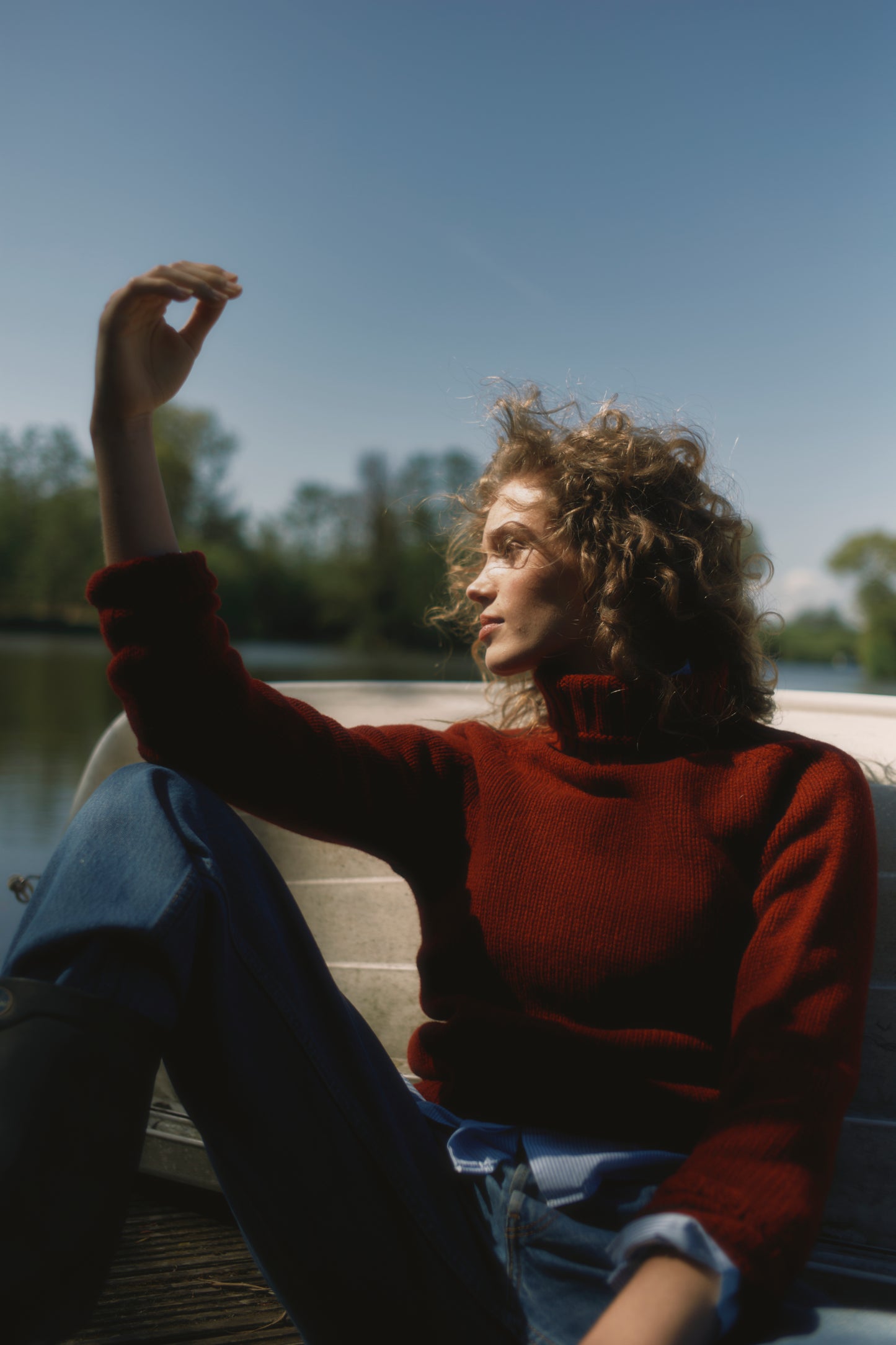 Model wearing a Big Softy Geelong Chunky Polo Neck Womens Jumper in colour Russet Red.