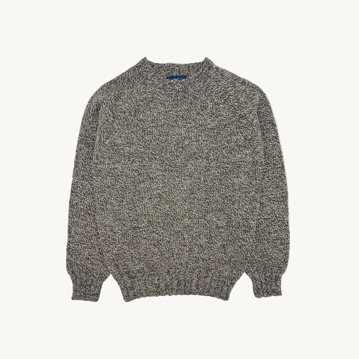 A flatbed photograph of a Bosie Blue Mogganer British Breed Sweater in colour Bovek