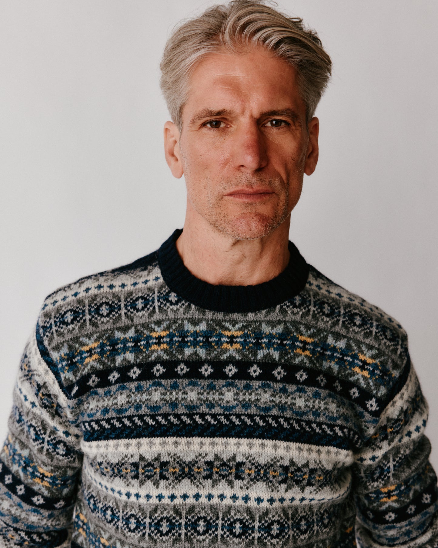 A model wearing a Bosie Blue Mogganer Crovie Fairisle in colour Navy.