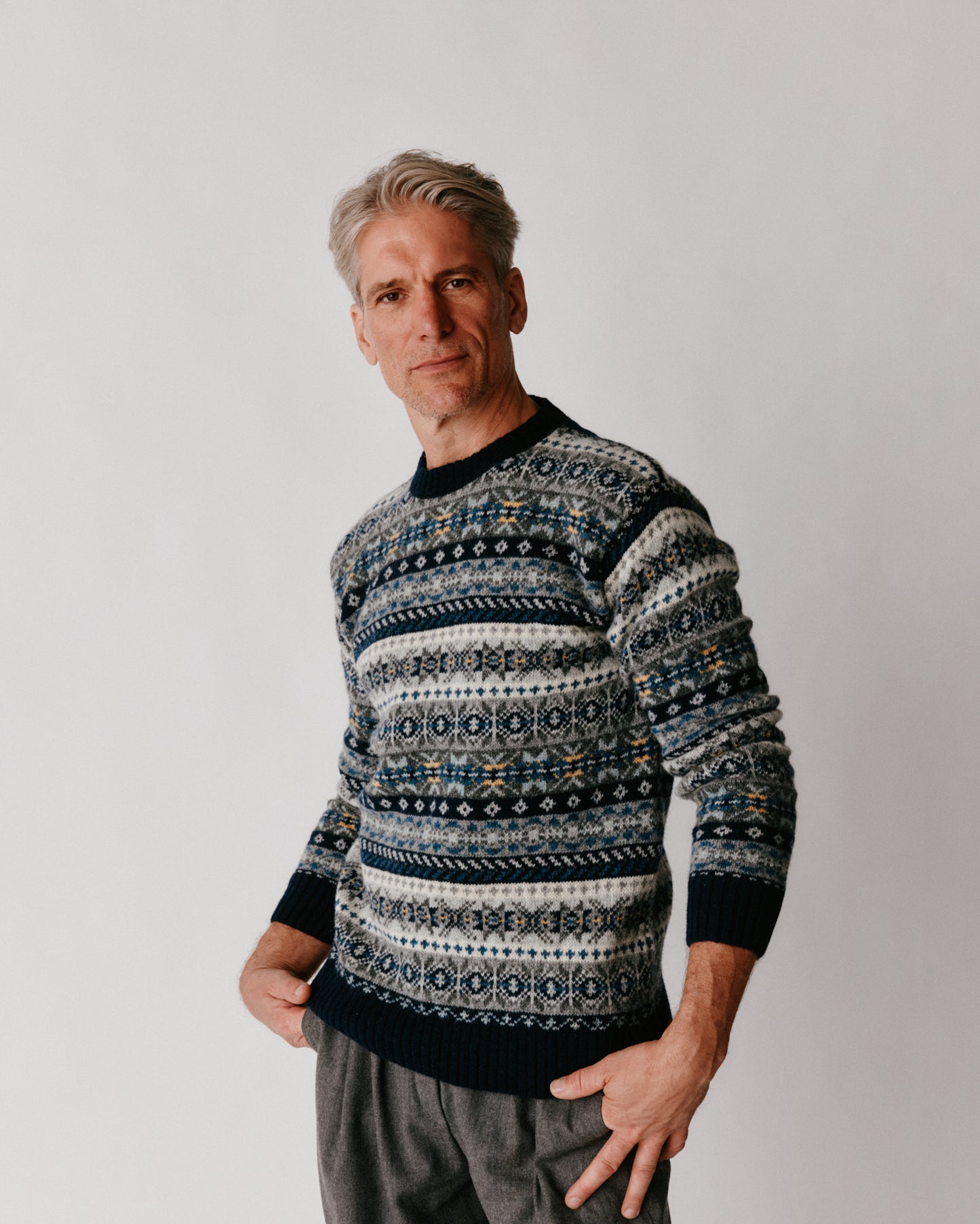 A model wearing a Bosie Blue Mogganer Crovie Fairisle in colour Navy.